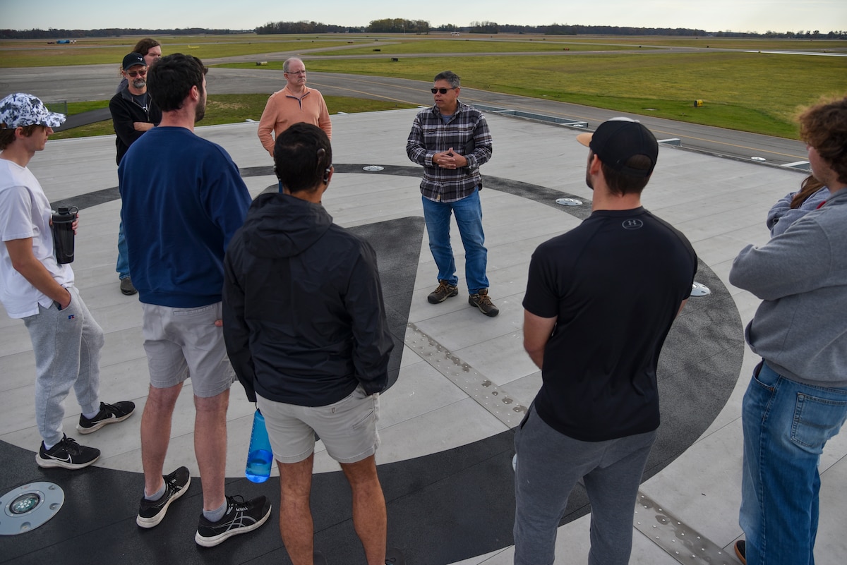 Hank Griffiths, AFWERX chief of test and airworthiness, talks to aerospace engineering students from Ohio State University at the Springfield-Beckley Municipal Airport, Ohio, Nov. 7, 2023. Griffiths invited the students to inform them about AFWERX, the innovation arm of the Department of the Air Force, and Advanced Air Mobility. (U.S. Air Force photo by Matthew Clouse)
