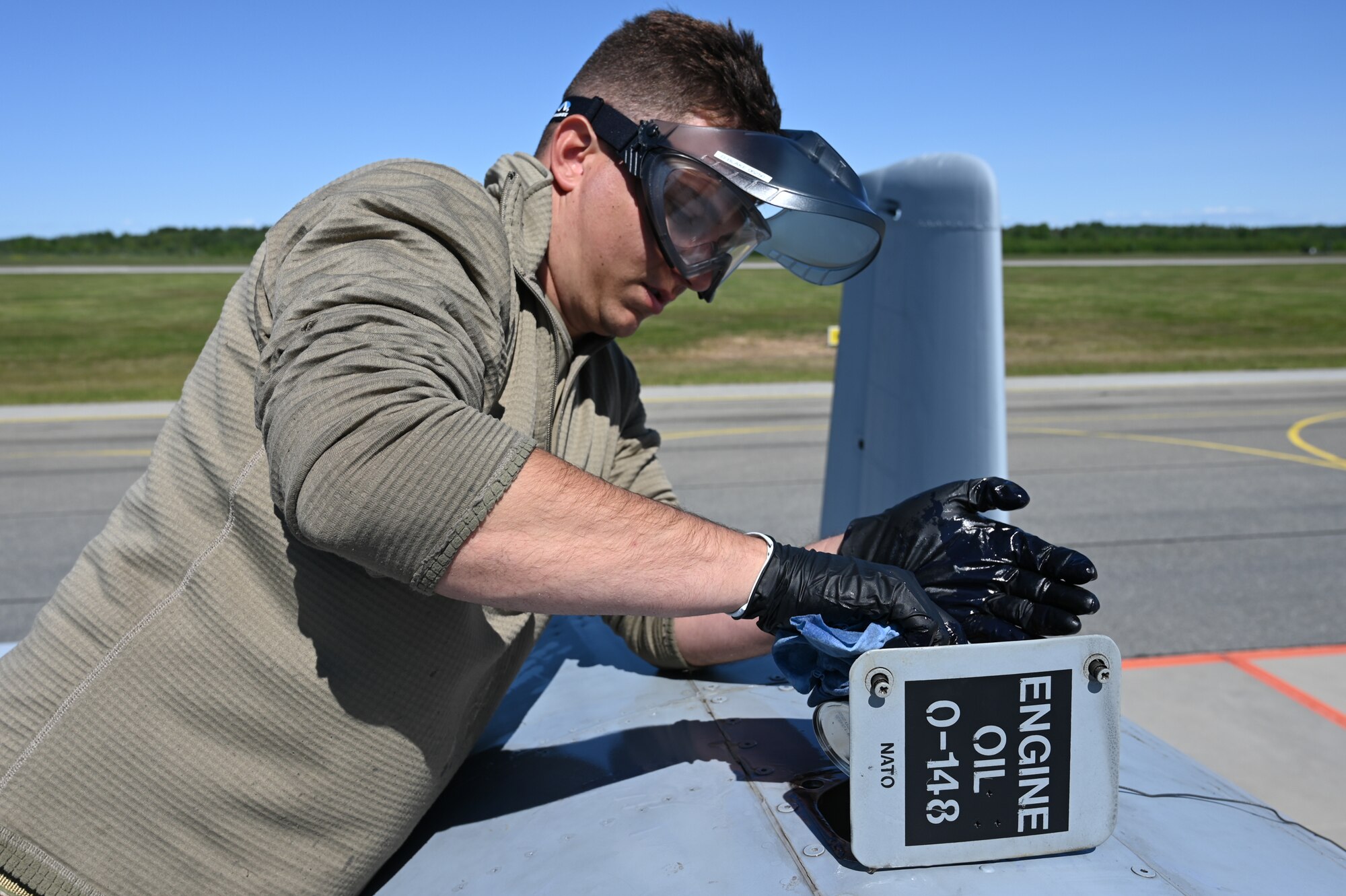 U.S. Air Force Staff Sgt. Derrick Blake, a crew chief assigned to the 175th Aircraft Maintenance Squadron, 175th Wing, Maryland National Guard, conducts joint oil analysis program procedures on an A-10C Thunderbolt II aircraft assigned to the 104th Fighter Squadron, in support of exercise Air Defender 2023 (AD23) flying operations, June 9, 2023, at Amari Air Base, Estonia.