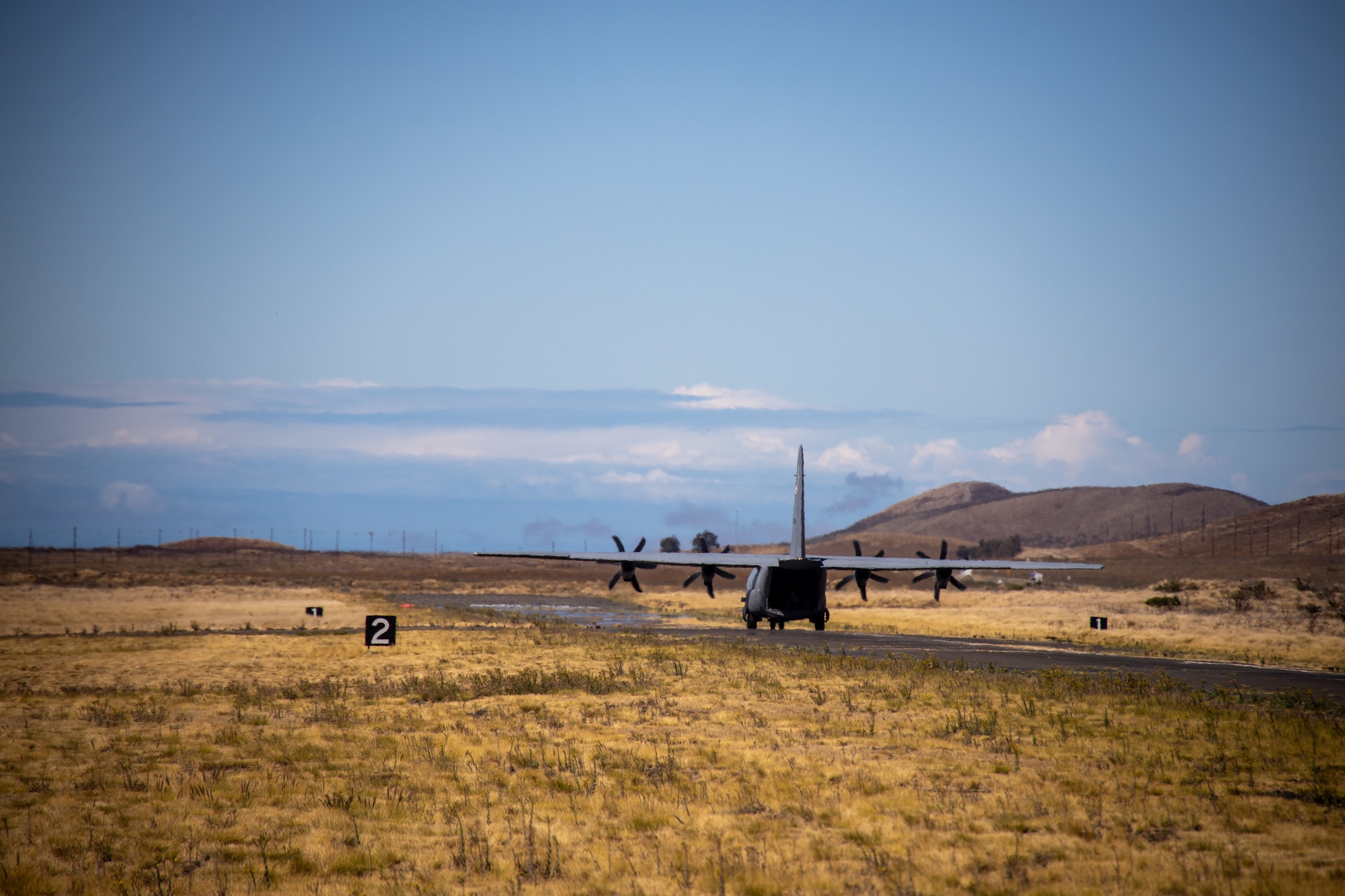 A C-130 taxis on the airfield.