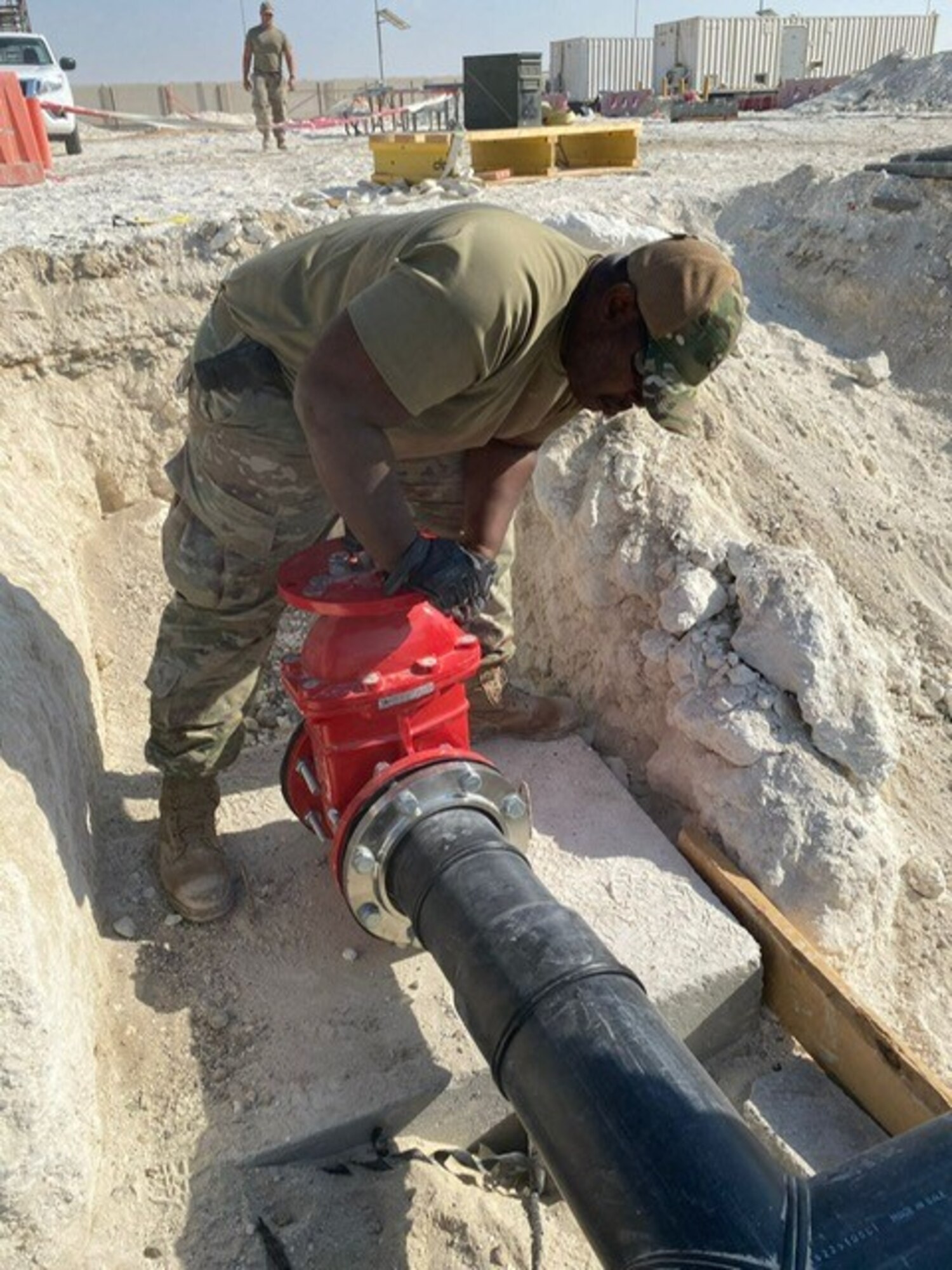 a man checks a fire hydrant