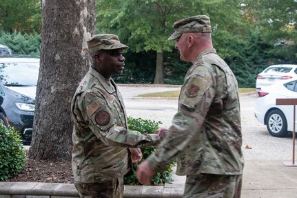 Chief Williams, left, shaking hands with Chief Fretwell.