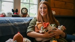 Photo of Senior Airman Emily Sorrell, a Security Forces Defender assigned to the 158th Fighter Wing, posing with her ‘amigurumi’ creations at the Vermont Air National Guard Base, South Burlington, Vermont, October 11, 2023.