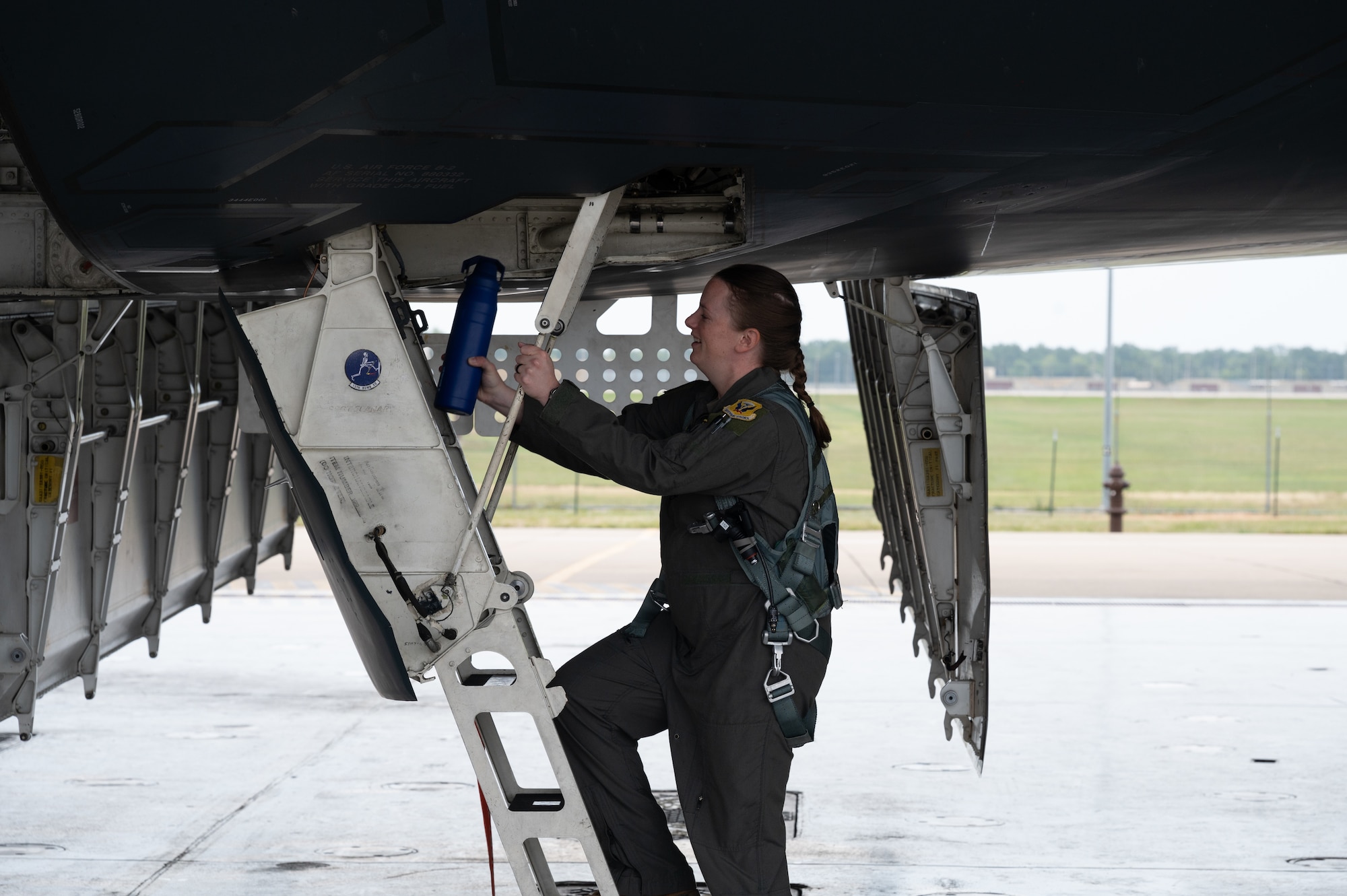 U.S. Air Force Capt. Jennifer Crum, 393rd Bomb Squadron assistant director of operations, boards a B-2 Spirit Bomber at Whiteman Air Force Base, Mo., Sept. 10, 2023. Crum made history by being the first pregnant B-2 pilot in the history of the airframe. (U.S. Air Force photo by Airman 1st Class Joseph Garcia)