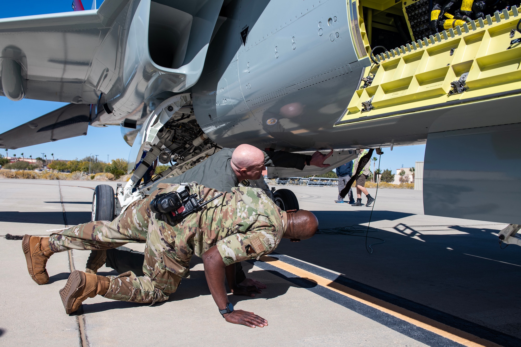 Col. Christopher, Individual Mobilization Augmentee to the 412th Test Wing Commander, and Col. Ahave Brown Jr., take a closer look at the T-7A Red Hawk after it arrived at Edwards Air Force Base, California, Nov. 8. The aircraft’s test campaign is being executed by the T-7A Integrated Test Force, part of the Airpower Foundations Combined Test Force in association with the 416th Flight Test Squadron. The Integrated Test Force is a partnership between the USAF and T-7A manufacturer, The Boeing Company. (Air Force photo by Giancarlo Casem)