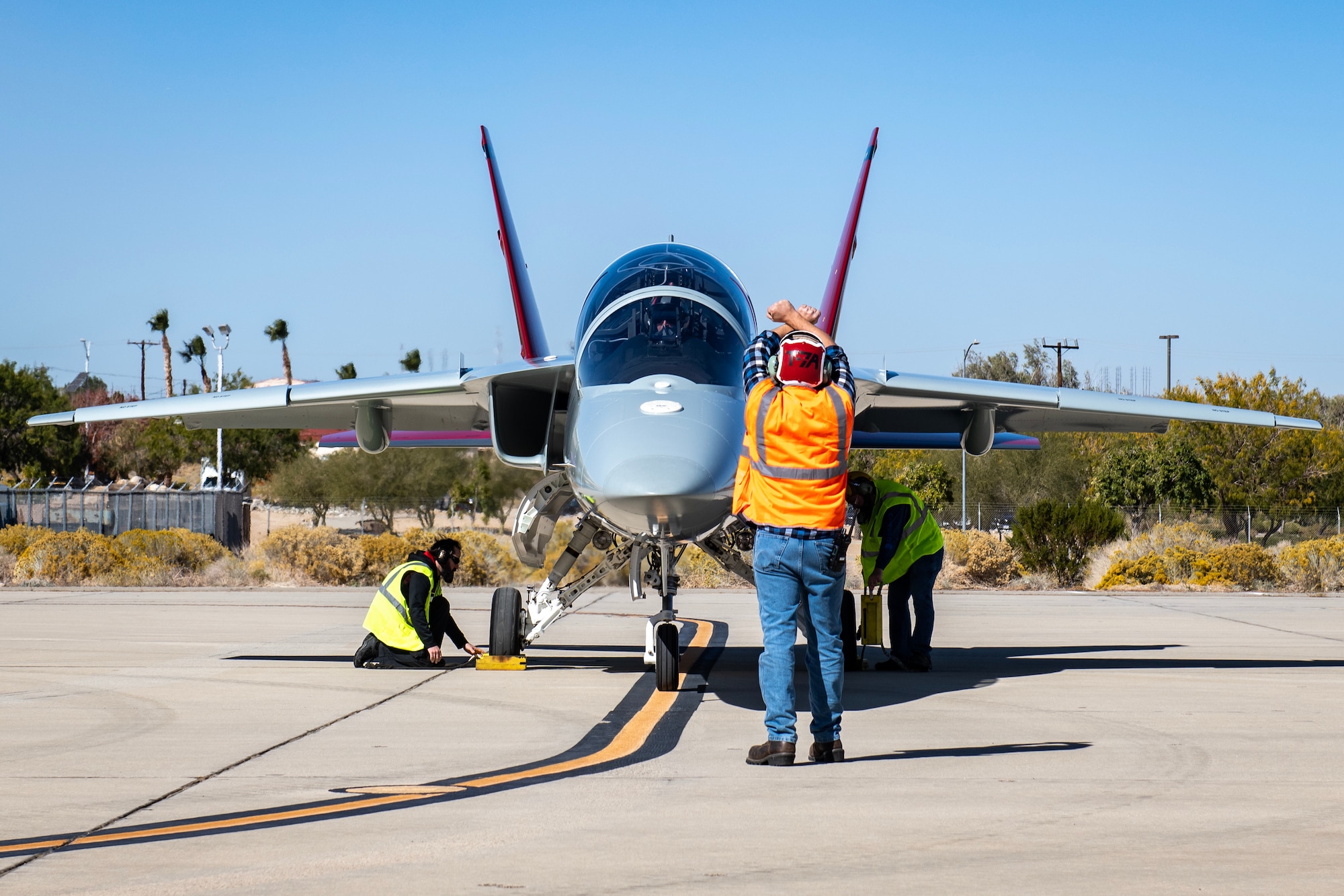 The first T-7A Red Hawk taxis at Edwards Air Force Base, California, Nov. 8. The aircraft’s test campaign is being executed by the T-7A Integrated Test Force, part of the Airpower Foundations Combined Test Force in association with the 416th Flight Test Squadron. The Integrated Test Force is a partnership between the USAF and T-7A manufacturer, The Boeing Company. (Air Force photo by Giancarlo Casem)