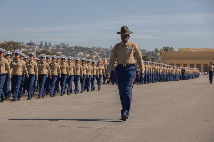 New Marines and drill instructors with Mike Company, 3rd Recruit Training Battalion, march in formation during a graduation ceremony at Marine Corps Recruit Depot San Diego, Nov. 8, 2023. Graduation took place at the completion of the 13- week transformation, which included training for drill, marksmanship, basic combat skills, and Marine Corps customs and traditions. (U.S. Marine Corps photo by Lance Cpl. Janell B. Alvarez)