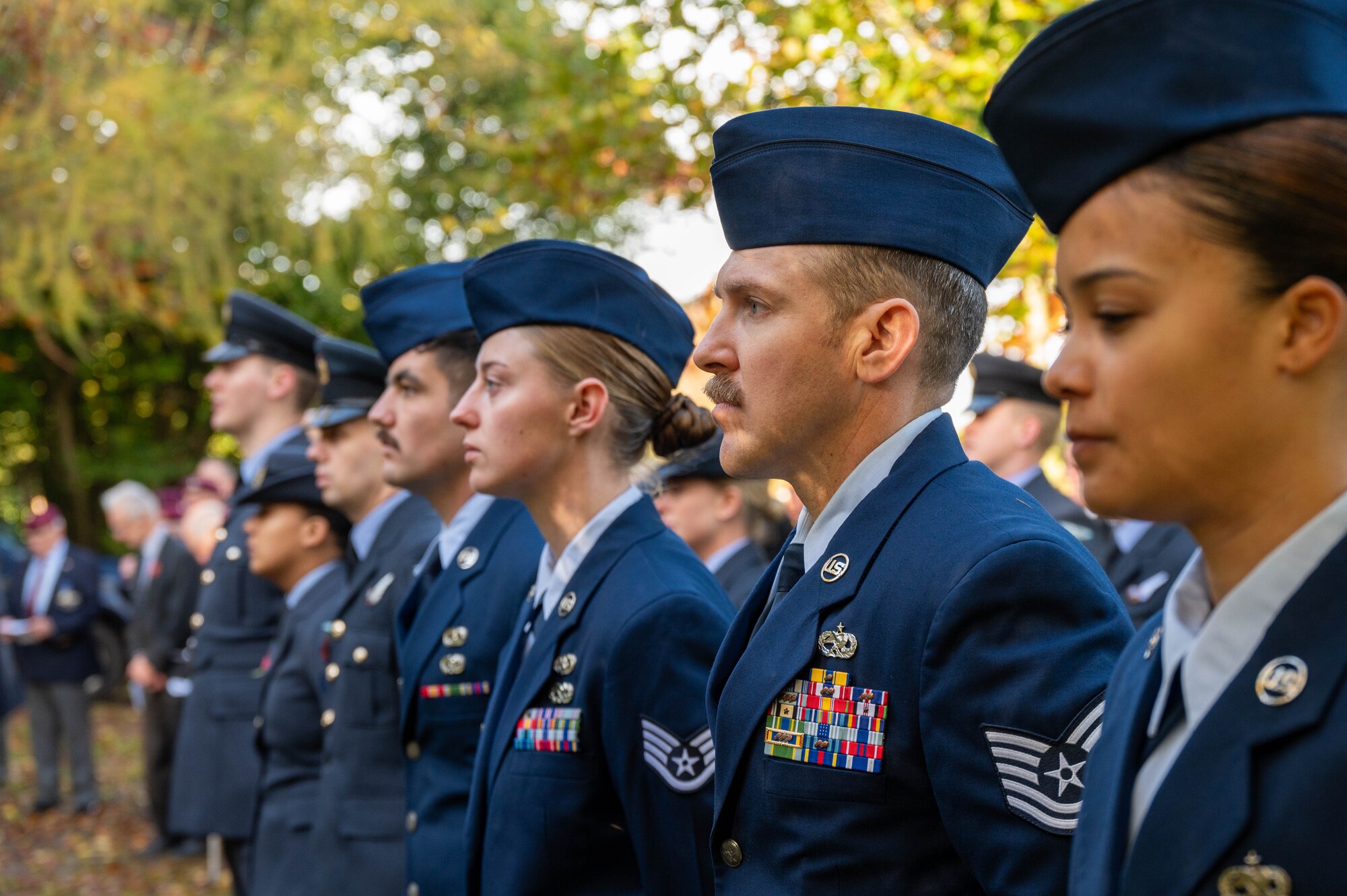 Airmen stand at attention during a Remembrance Day ceremony.