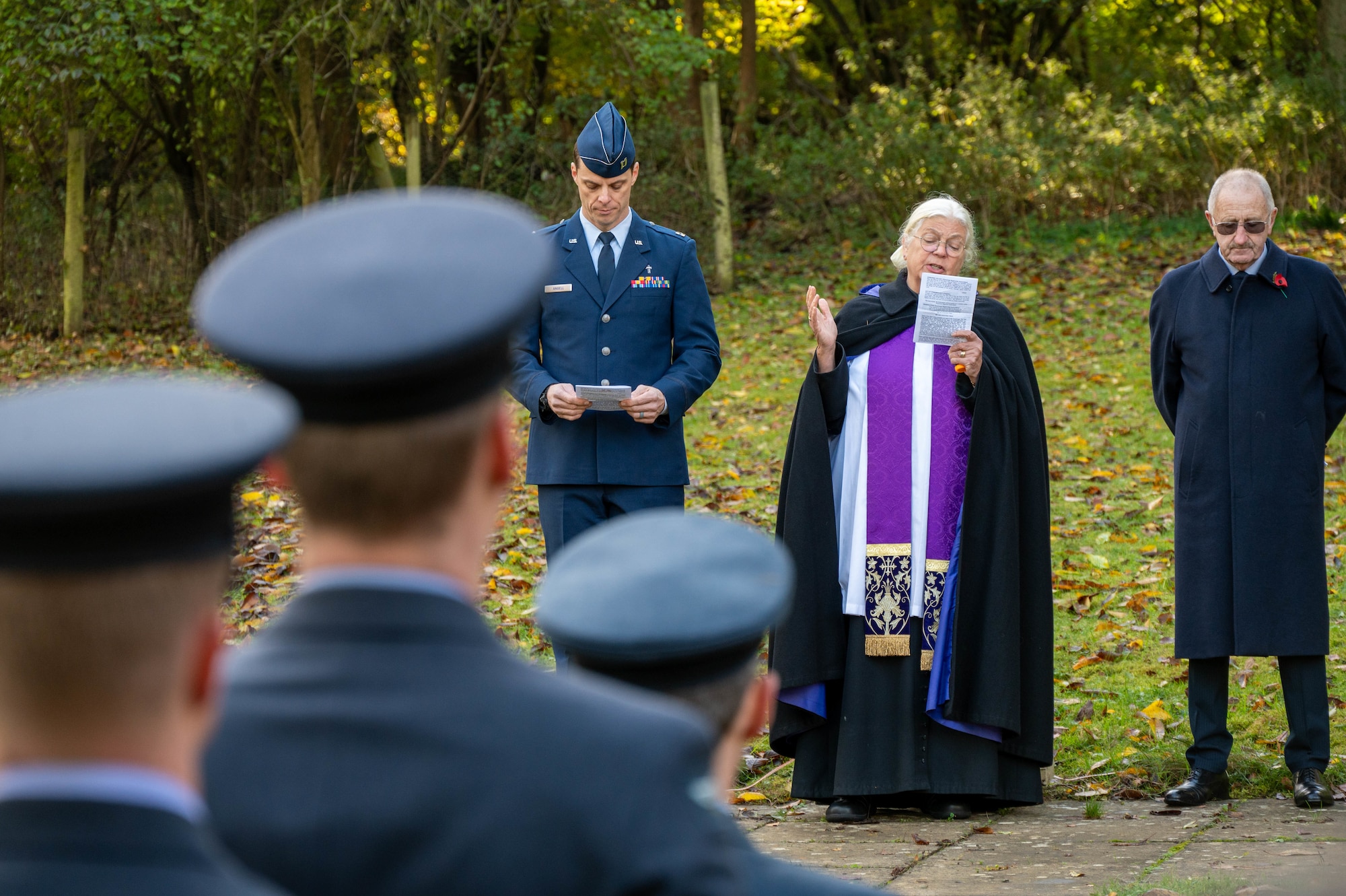 Religious members speak during a Remembrance Day ceremony.