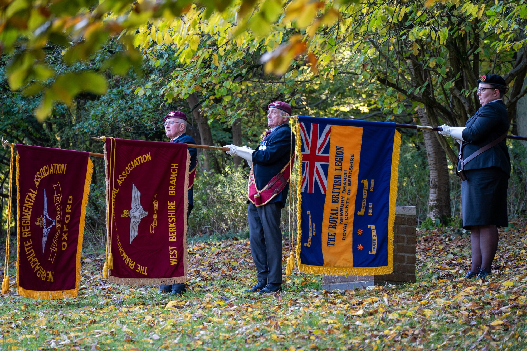 Flag bearers present the colors during a Remembrance Day ceremony.