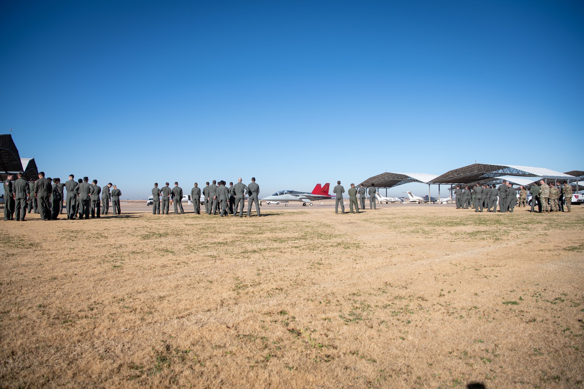 More than 200 Airmen, including student and instructor pilots gathered in front of Air Control Tower at Vance Air Force Base, Oklahoma, Nov. 7, 2023, to get a close look at a T-7A Redhawk