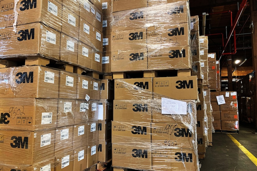 Multiple pallets of boxes sit in a warehouse.