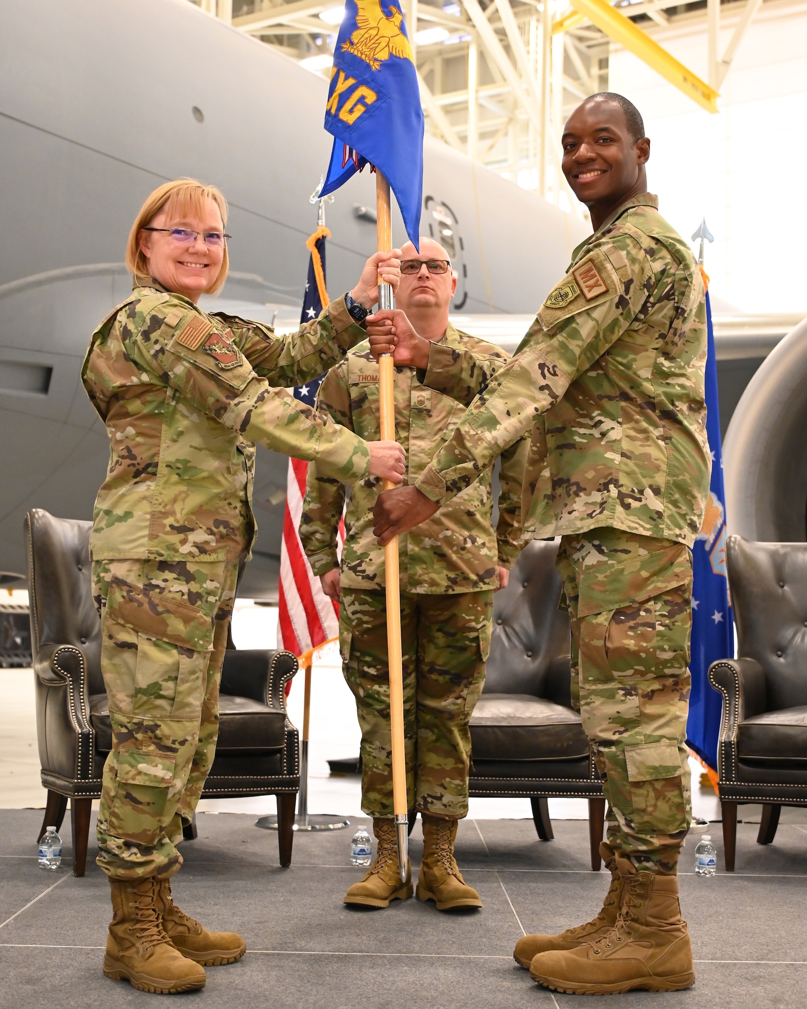 (Left to right) Col. Cynthia Welch, 931st Air Refueling Wing commander, hands the guidon to Lt. Col. Jermaine Campbell, incoming 931st Maintenance Group commander, during an official change of command ceremony Nov. 4, 2023, at McConnell Air Force Base, Kansas