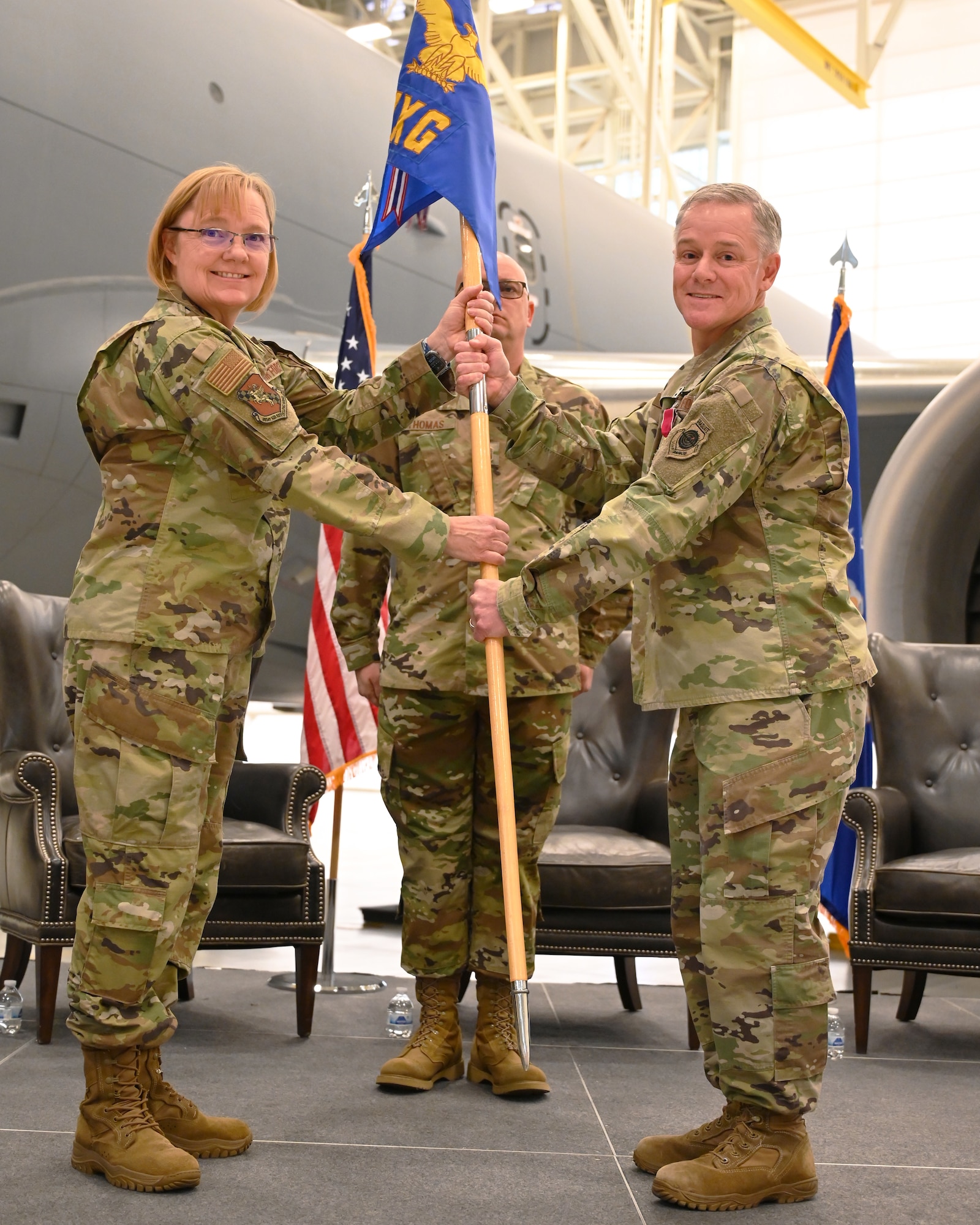 (Left to right) Col. Cynthia Welch, 931st Air Refueling Wing commander, takes the guidon from Col. Robbert Thompson, outgoing 931st Maintenance Group commander, during an official change of command ceremony Nov. 4, 2023, at McConnell Air Force Base, Kansas.