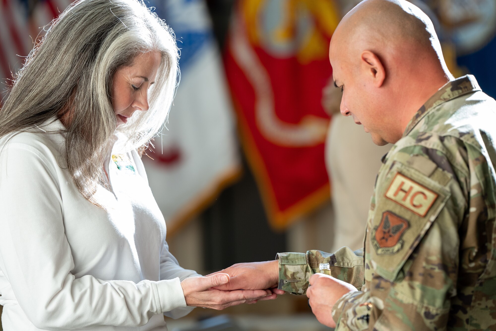 Hands being blessed in a ceremony