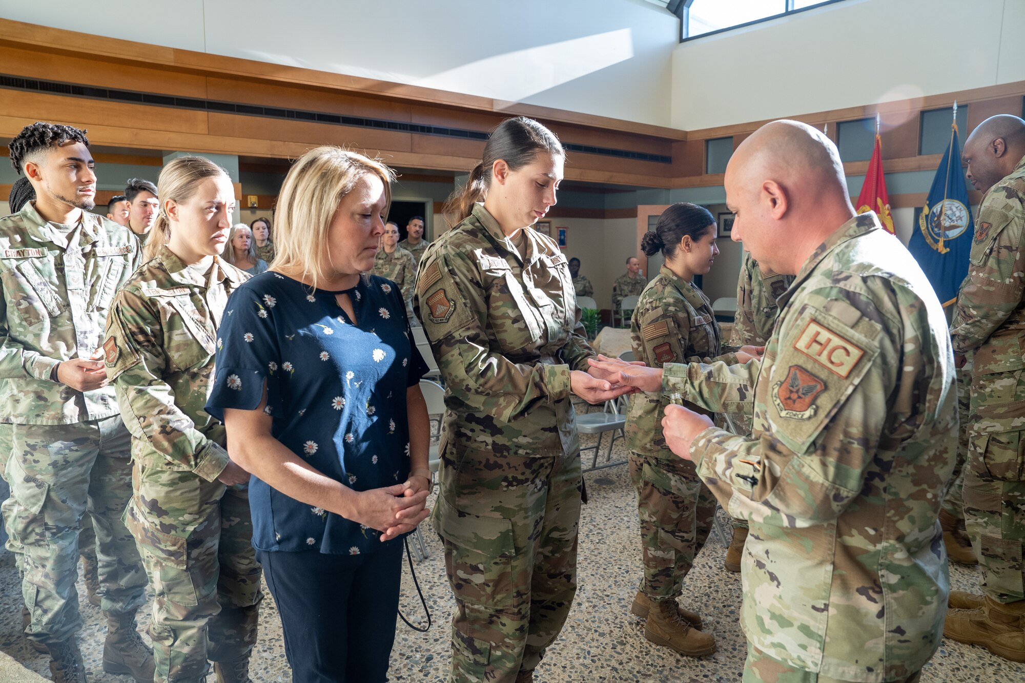 Hands being blessed in a ceremony