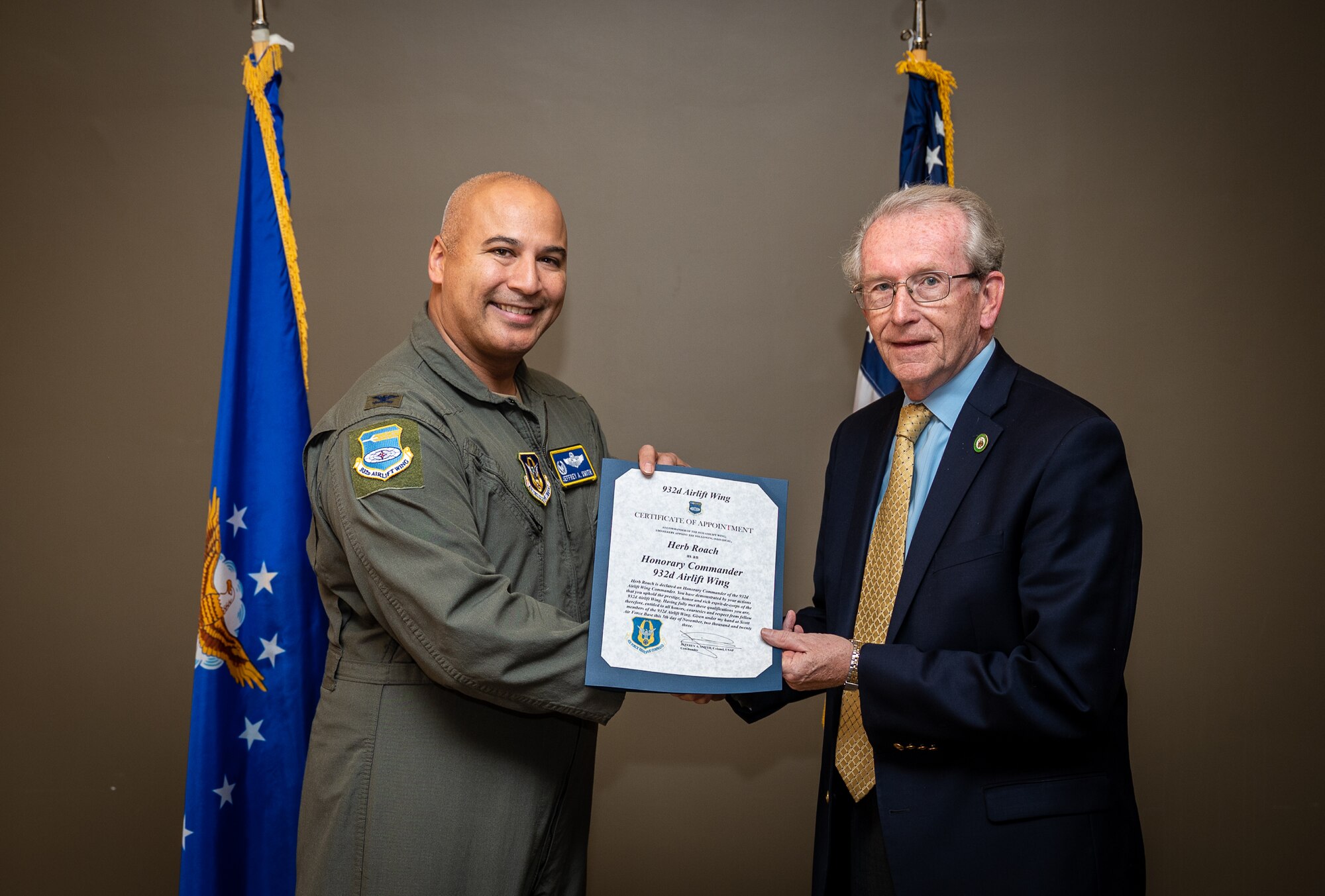 Mayor Herb Roach, City of O’Fallon, and the newly instated 932nd Airlift Wing Honorary Commander, is presented his certificate of appointment into the 932nd Airlift Wing Honorary Commanders program by Col. Jeffrey Smith, 932nd AW commander, Nov 5th, 2023, Scott Air Force Base, Illinois. The Honorary Commanders will serve as a liaison between service members and the public to increase communication and collaboration between the military and the local community, giving Citizen Airmen and surrounding townships a greater appreciation of one another. (U.S. Air Force photo by Christopher Parr)