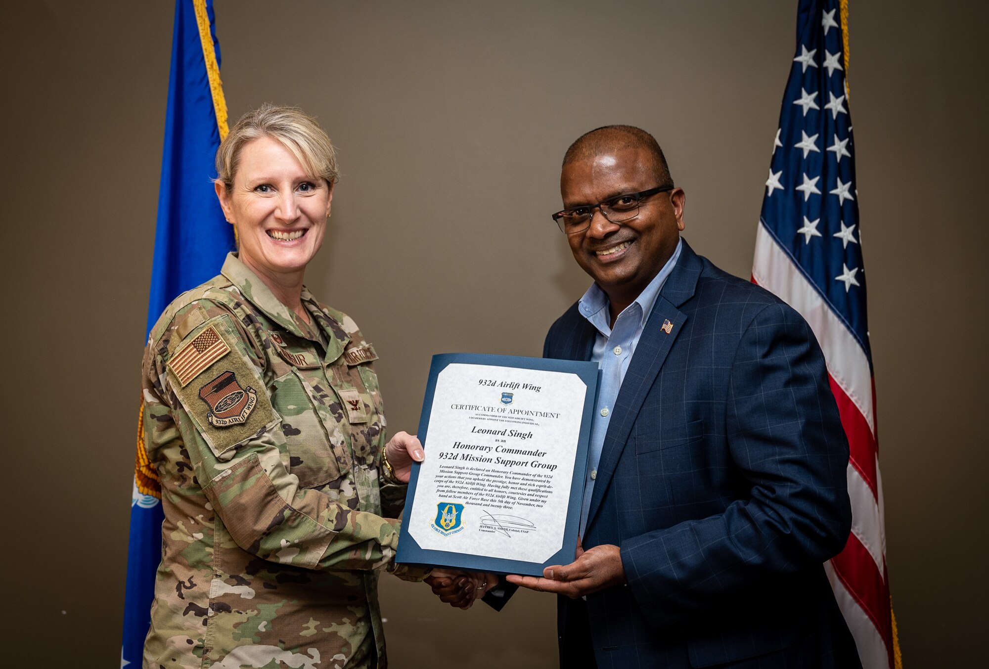 Lenny Singh, President/Chairman of Ameren Illinois, and the newly instated 932nd Mission Support Group Honorary Commander, is presented his certificate of appointment into the 932nd Airlift Wing Honorary Commanders program by Col. Dori Mansur, MSG commander, Nov 5th, 2023, Scott Air Force Base, Illinois. The Honorary Commanders will serve as a liaison between service members and the public to increase communication and collaboration between the military and the local community, giving Citizen Airmen and surrounding townships a greater appreciation of one another. (U.S. Air Force photo by Christopher Parr)