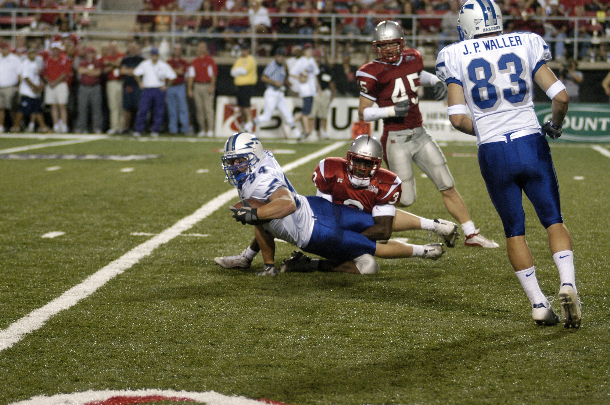 Air Force Academy tight end Carsten Stahr checks to see if he made the first down after pulling in a pass in the red zone. By adding 139 yards of passing to their triple-option ground attack, the Falcons defeated University of Nevada-Las Vegas 27-10 in their Sept. 18 conference opener and advanced to 2-1. The Falcons next play No. 15 Utah on Sept. 25. (U.S. Air Force photo by John Van Winkle)