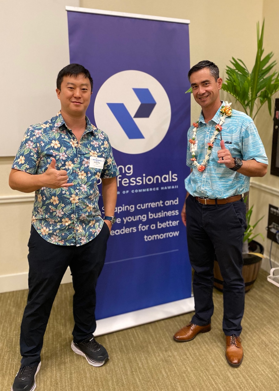Navy Capt. Al Hutchison, right, deputy fleet civil engineer, U.S. Pacific Fleet, and his protégé Phil Mok, from Baltimore, attend a wrap-up celebration Oct. 18, 2023 for the Chamber of Commerce Young Professionals Program, Mentor Hawaii. (Photo courtesy of Young Professionals Committee)