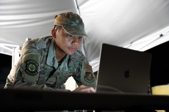 Joint Task Force-Red Hill (JTF-RH) Access Control Point team member, U.S. Air Force Senior Airman Brandon Murillo, maintains access records during routine nighttime operations at Red Hill Bulk Fuel Storage Facility (RHBFSF), Halawa, Hawaii, Nov. 7, 2023.