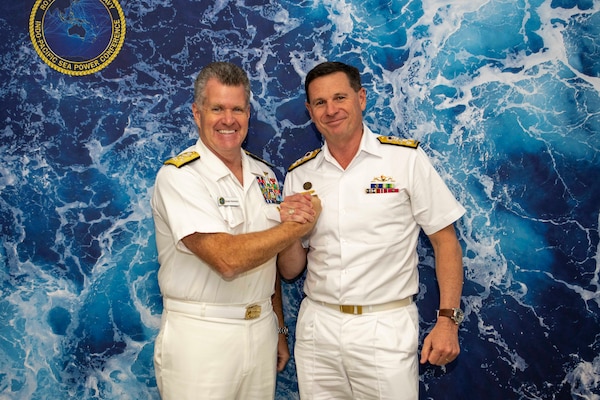 Adm. Samuel Paparo, commander, U.S. Pacific Fleet, left, poses for a photo with Vice Adm. Mark Hammond, chief, Royal Australian Navy, during a bilateral engagement at the Indo Pacific International Maritime Exposition 2023 in Sydney, Nov. 8. IP23 emphasizes the commitment of the United States, Australia, and partner nations to a free and open Indo-Pacific region. (U.S. Navy photo by Mass Communications Specialist 2nd Class Jeremy R. Boan)
