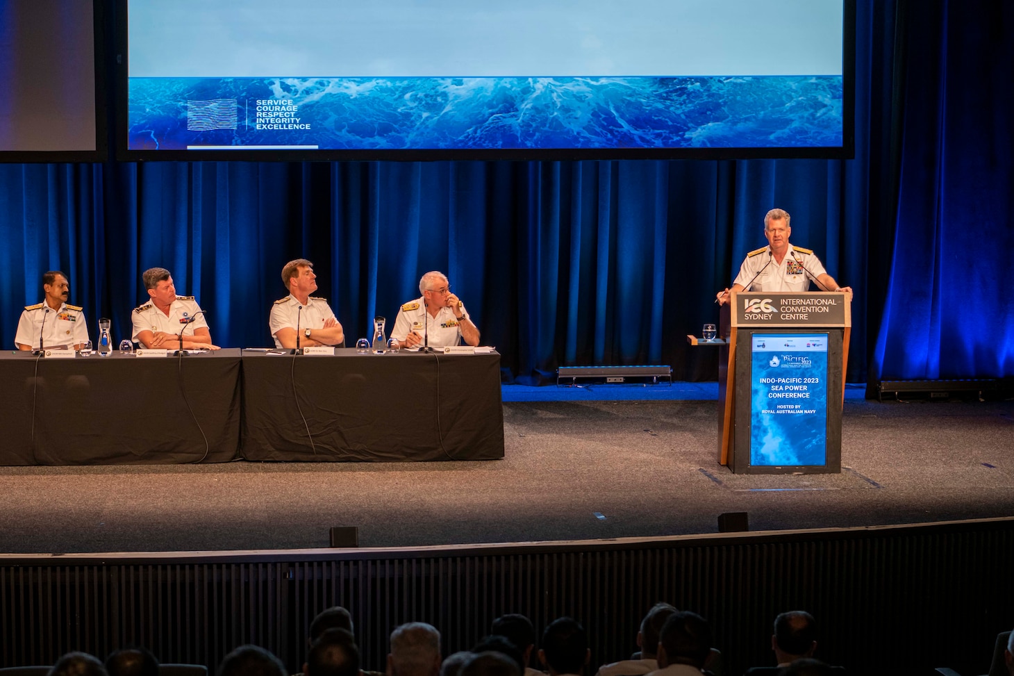 Adm. Samuel Paparo, commander, U.S. Pacific Fleet, right, delivers remarks during a panel discussion of senior naval leaders from Australia, Canada, France, India, UK and the U.S. at the Indo Pacific International Maritime Exposition 2023 in Sydney, Nov. 8. IP23 emphasizes the commitment of the United States, Australia, and partner nations to a free and open Indo-Pacific region. (U.S. Navy photo by Mass Communications Specialist 2nd Class Jeremy R. Boan)