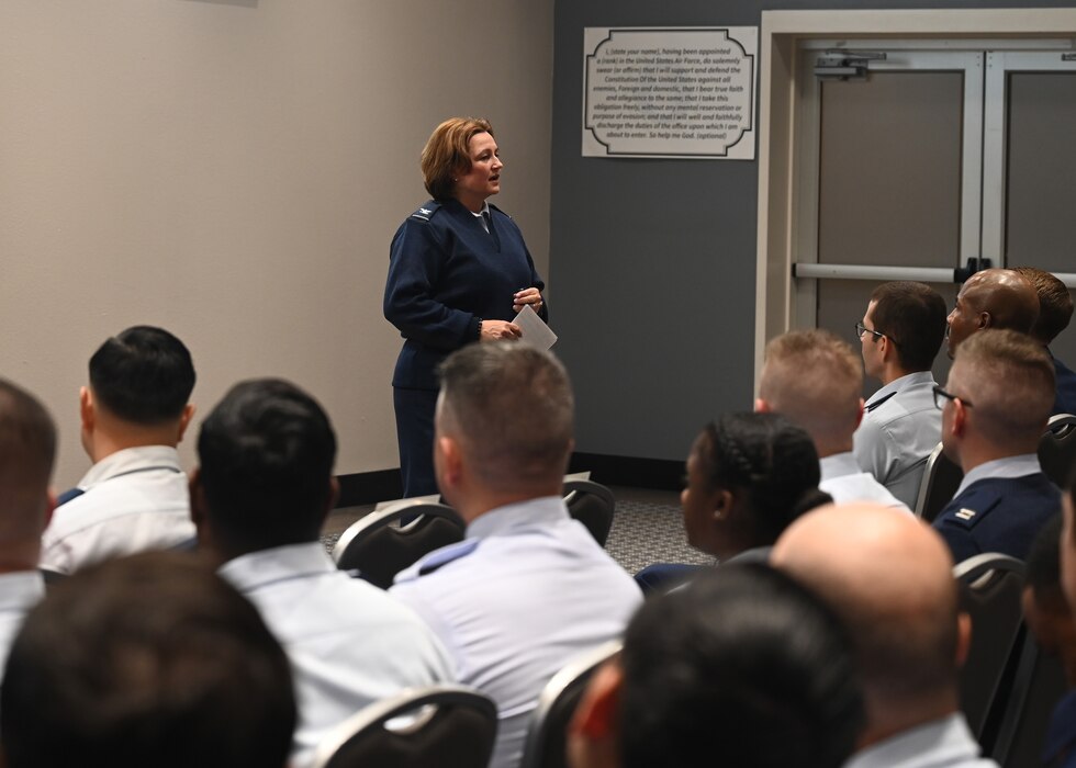 U.S. Air Force Col. Angelina Maguinness, 17th Training Wing commander, addresses the wing during the Commander’s All-Call at Goodfellow Air Force Base, Texas, Nov. 9, 2023. Maguinness emphasized the importance of military discipline and having a unified force. (U.S. Air Force photo by Senior Airman Ethan Sherwood)