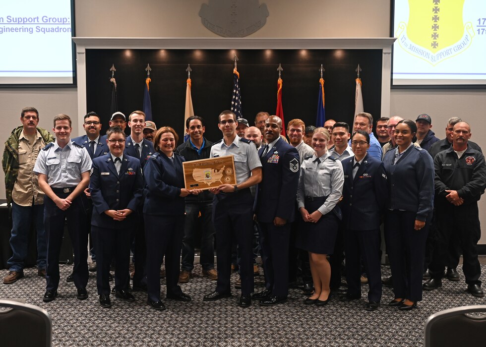 The 17th Civil Engineering Squadron accepts the Unit of the Quarter Award at Goodfellow Air Force Base, Texas, Nov. 9, 2023. Quarterly awards are a tradition that honors exceptional individuals and units for their outstanding contributions to the 17th TRW mission. (U.S. Air Force photo by Senior Airman Ethan Sherwood)
