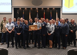 The 17th Civil Engineering Squadron accepts the Unit of the Quarter Award at Goodfellow Air Force Base, Texas, Nov. 9, 2023. Quarterly awards are a tradition that honors exceptional individuals and units for their outstanding contributions to the 17th TRW mission. (U.S. Air Force photo by Senior Airman Ethan Sherwood)