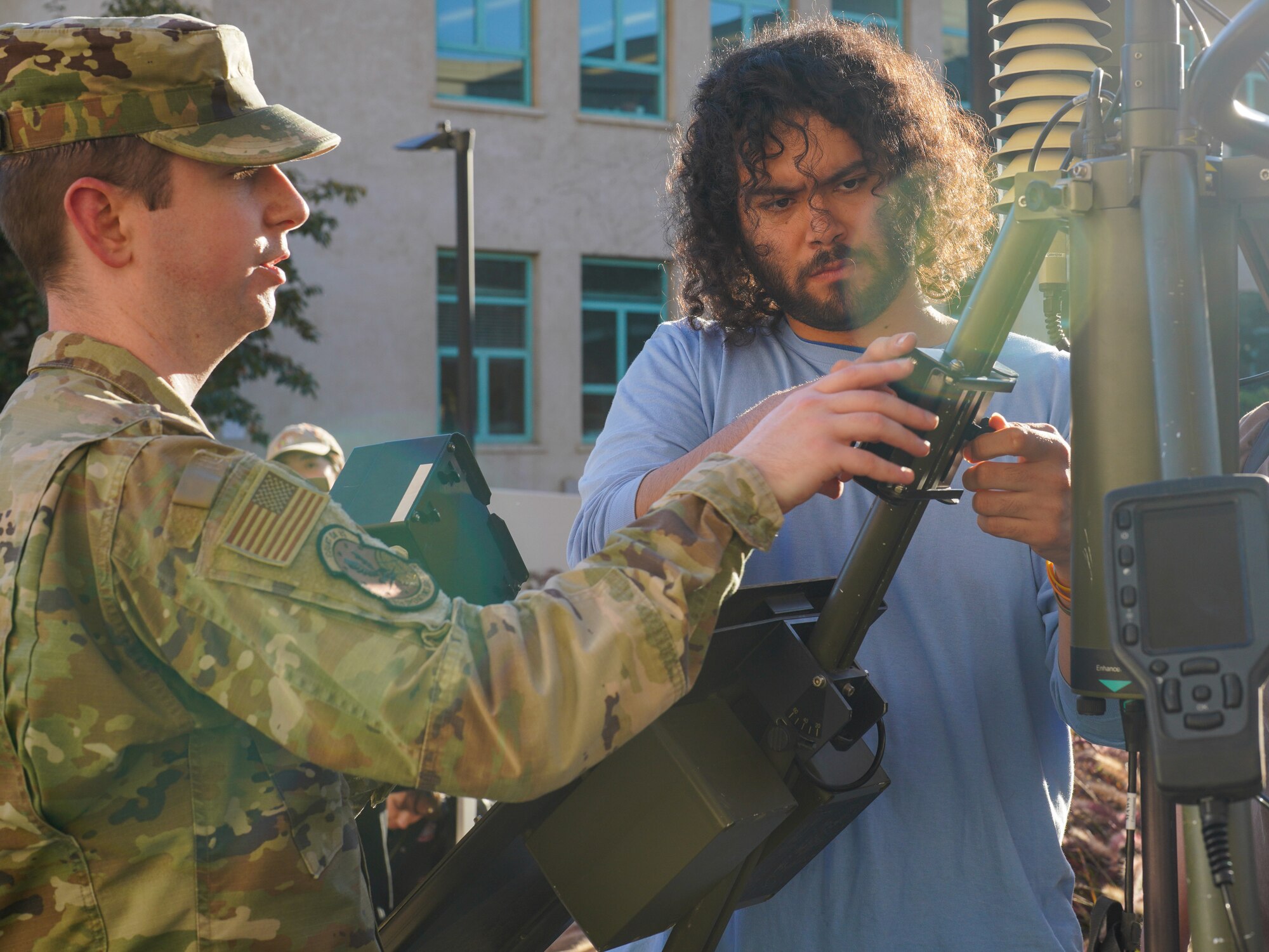 U.S. Air Force Tech. Sgt Zachary Cash, 9th Operations Support Squadron weather forecaster is assisted by Ivan Agudelo, a senior at the University of California, Davis in assembling a tactical meteorological observing system (TMOS) at the University of California, Davis, Nov. 07, 2023.