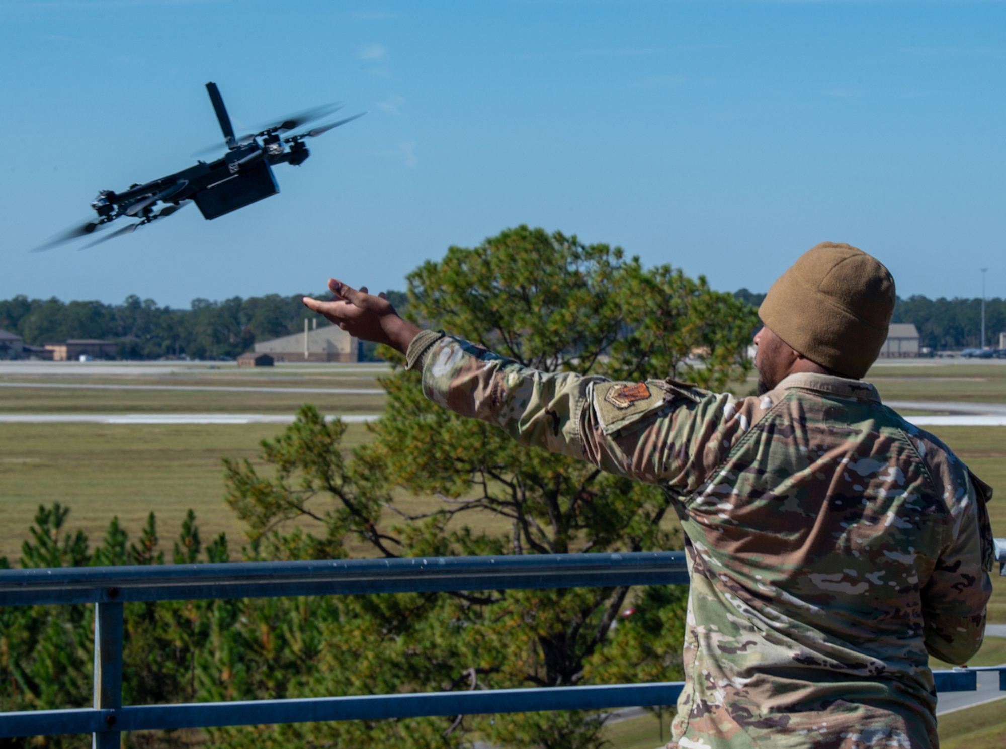 U.S. Air Force Senior Airman Curtis Filliyor, 823rd Base Defense Squadron small unmanned surveillance aircraft system operator, launches a drone to support the full mission profile exercise at Moody Air Force Base, Georgia, Nov. 2, 2023. Drones are used for support and reconnaissance without putting troops in danger. (U.S. Air Force photo by Airman 1st Class Leonid Soubbotine)
