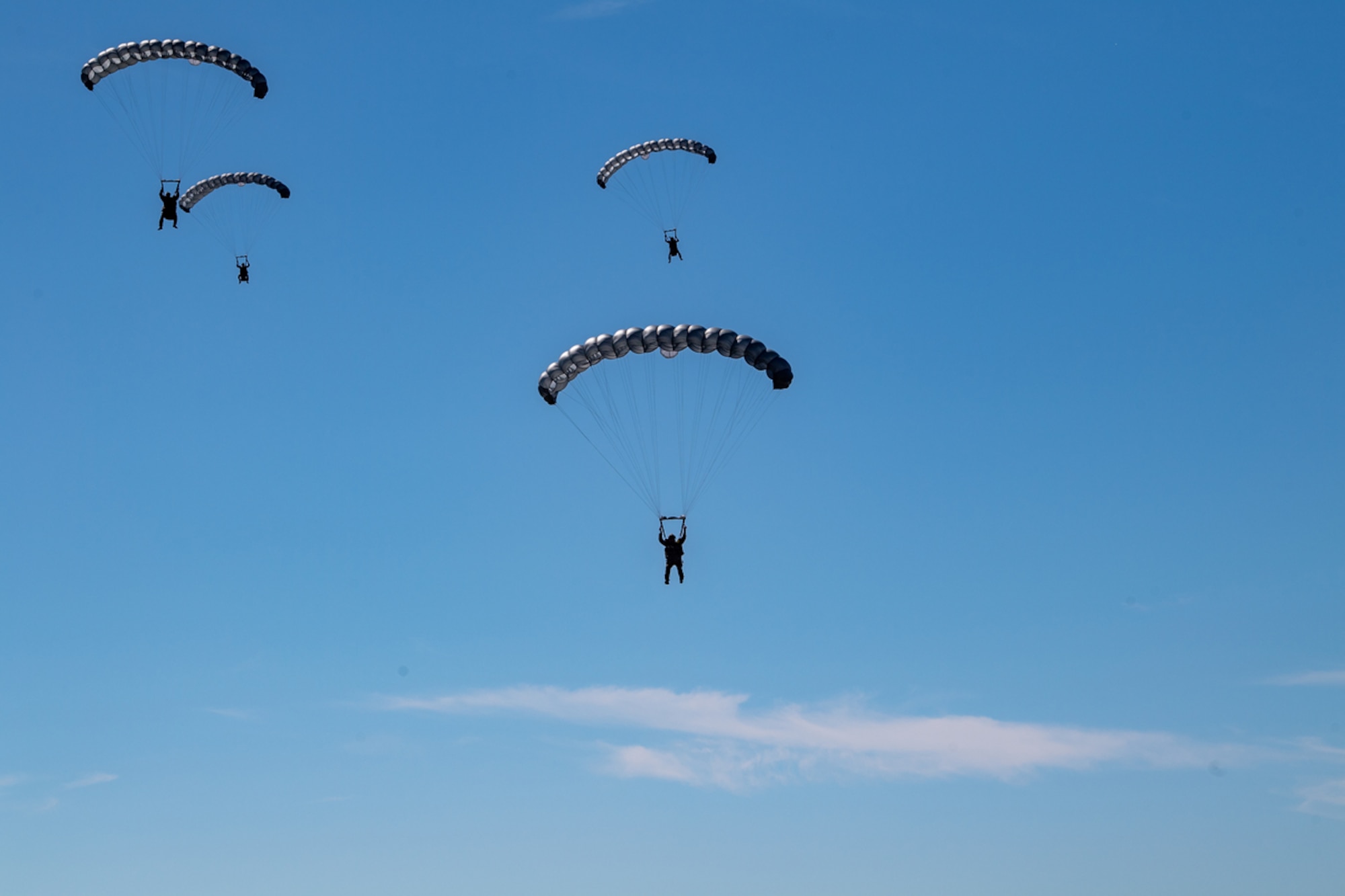 U.S. Air Force Pararescuemen assigned to the 38th Rescue Squadron jump out of an HC-130J Combat King II aircraft during a Full Mission Profile exercise at Moody Air Force Base, Georgia, Nov. 2, 2023. The training included Pararescuemen from the 38th RQS, members from the 823rd Base Defense Squadron, and members from the 820th Combat Operations Squadron. (U.S. Air Force Photo by Senior Airman Courtney Sebastianelli)