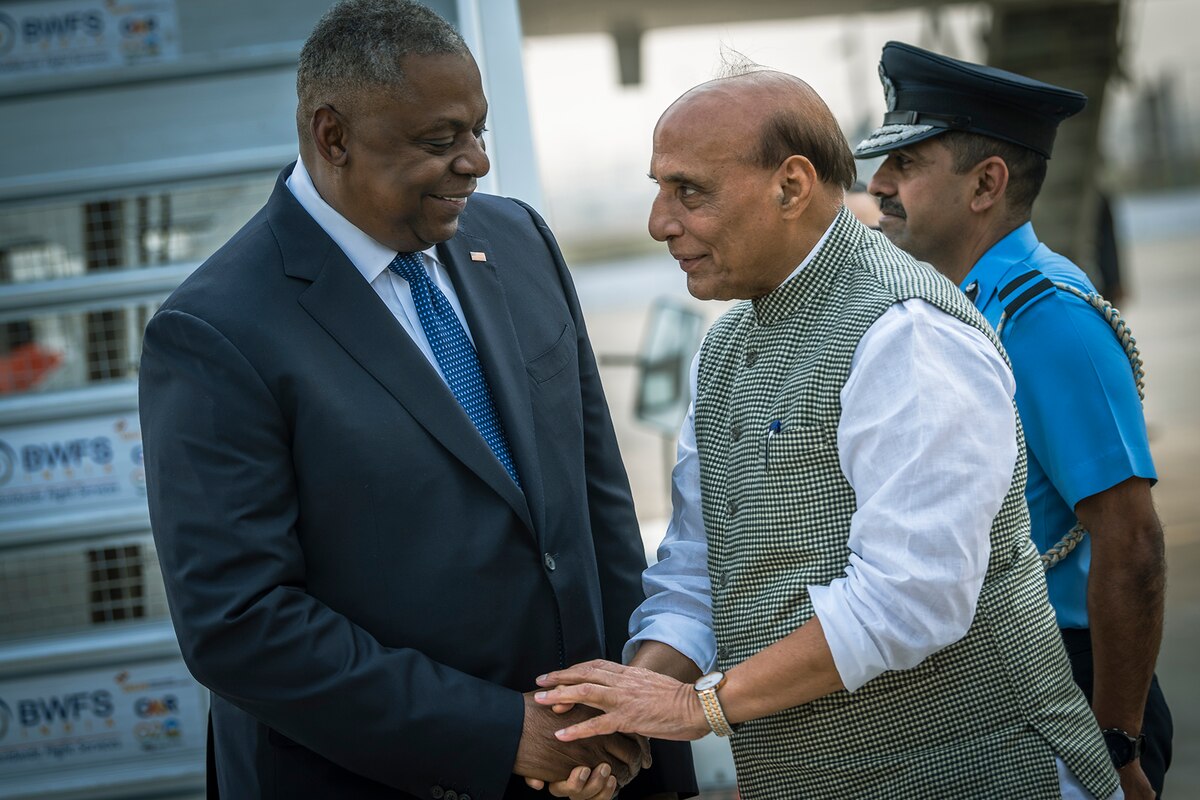 Two people shake hands.