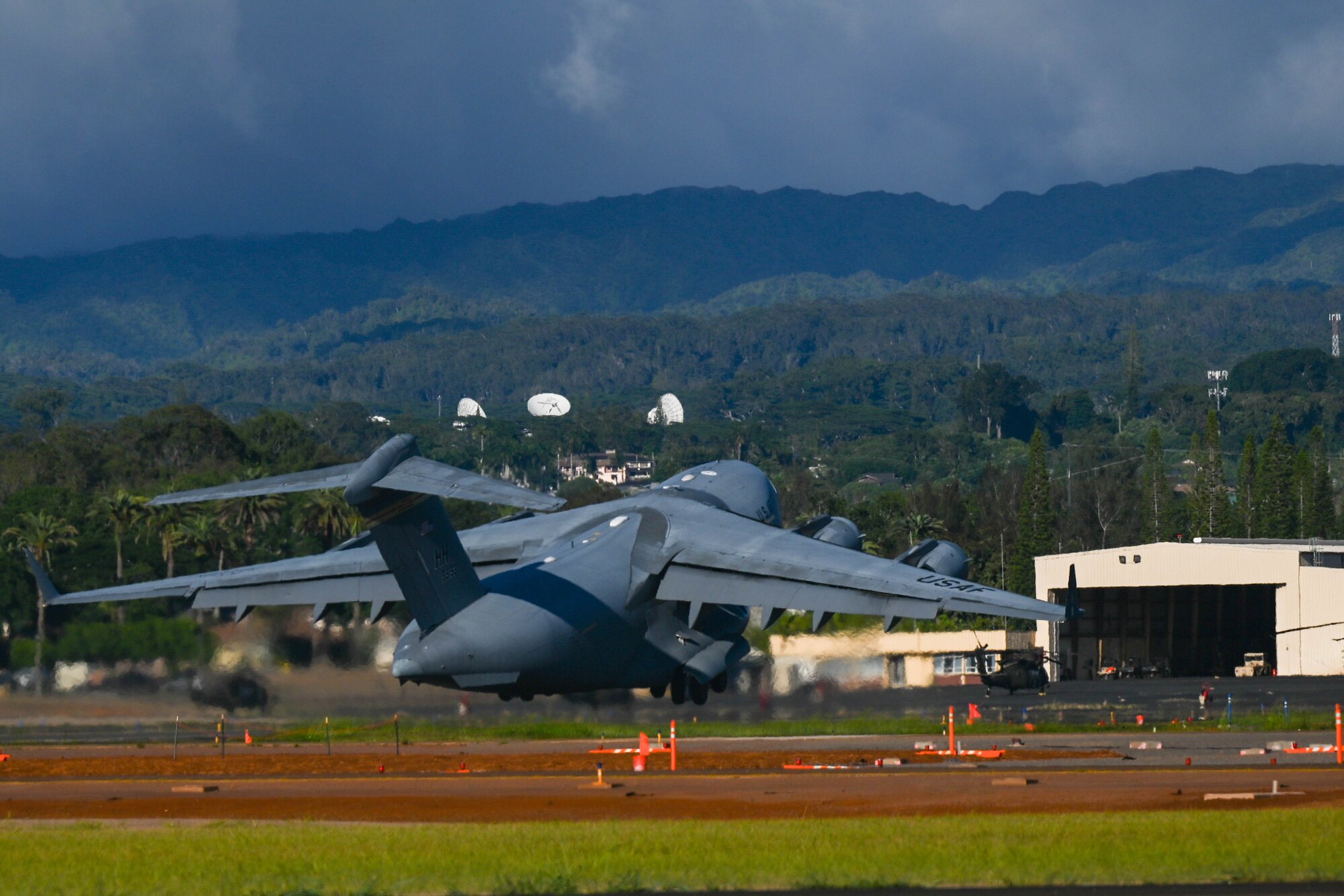 A C-17 Globemaster III assigned to the 15th Wing takes off during the Joint Pacific Multinational Readiness Center 24-01 at Wheeler Army Airfield, Hawaii, Nov. 3, 2023. JPMRC 24-01 is a tangible demonstration of the Theater Army’s critical role in the Indo-Pacific of enabling the Joint Force, building trust with allies and partners, and shaping the future force through innovation and experimentation. (U.S. Air Force photo by Senior Airman Makensie Cooper)