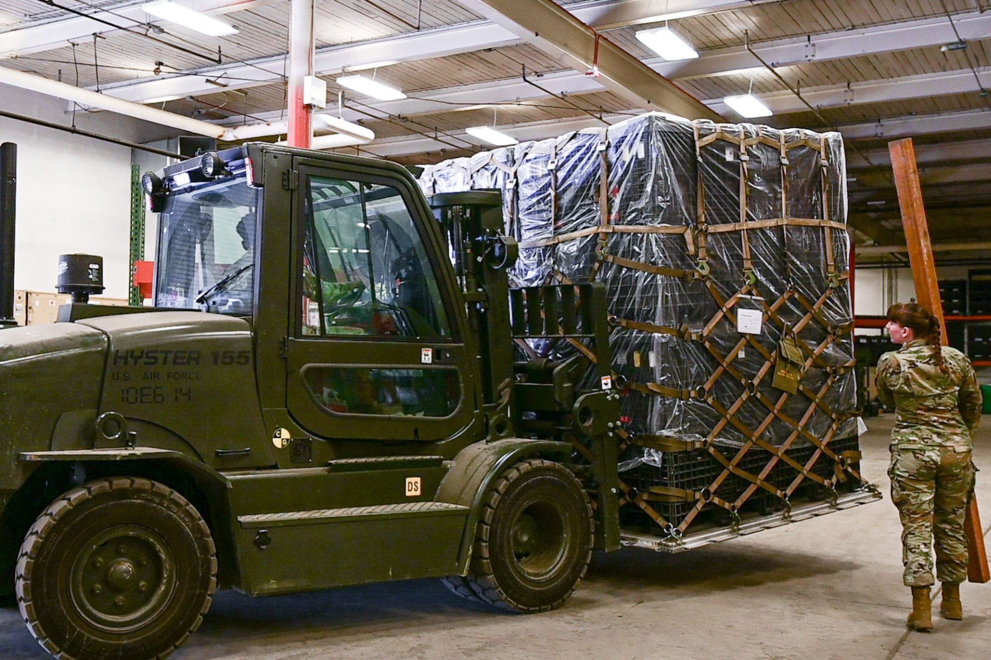 Airmen assigned to the 673d Medical Group move a pallet of medical supplies as part of Polar Force 24-2 on Joint Base Elmendorf-Richardson, Alaska, Nov. 7, 2023.