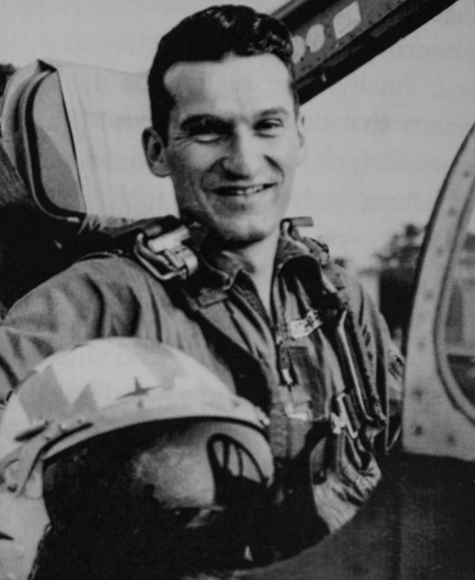 Retired U.S. Air Force Lt. Col. Richard Earl Michaud poses for a photo inside of an aircraft.