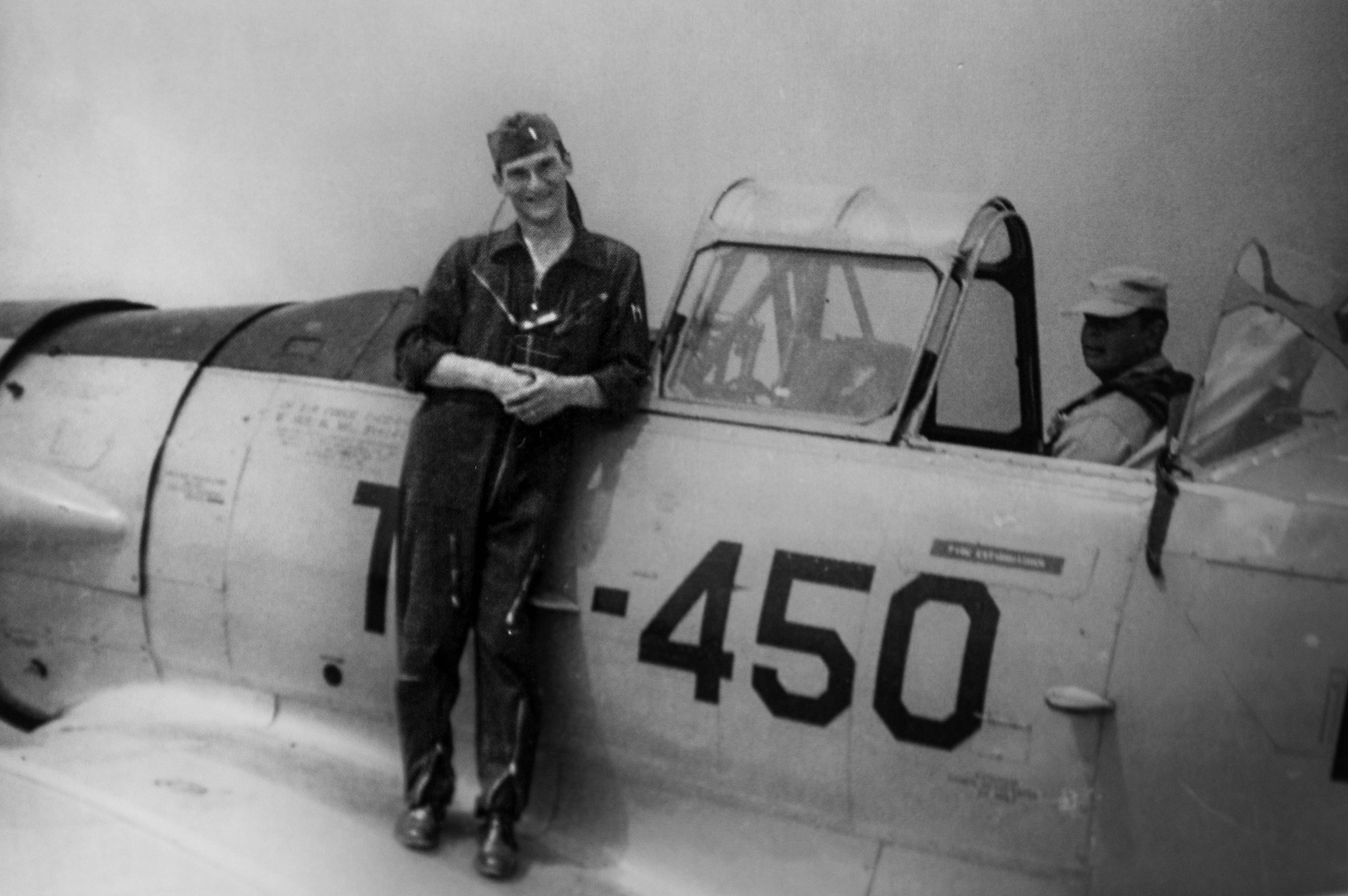 Retired U.S. Air Force Lt. Col. Richard Earl Michaud, retired pilot, and squadron commander, poses in front of a T-6A Texan II.