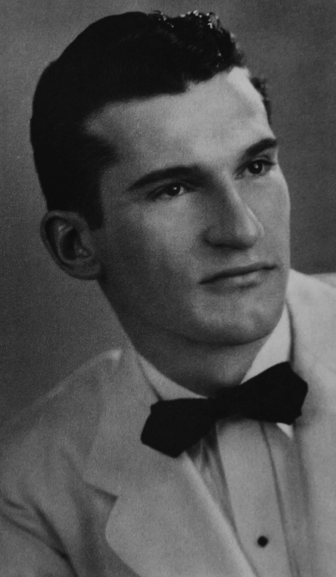 Retired U.S. Air Force Lt. Col. Richard Earl Michaud poses for his yearbook photo for Utah State Agricultural College.