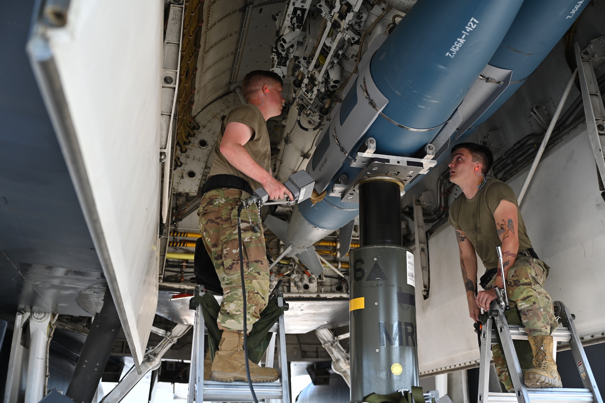 Members of the 28th Aircraft Maintenance Squadron weapons load crew insert an inert joint air-to-surface standoff missile into a B-1B Lancer during a weapons load competition at Ellsworth Air Force Base, South Dakota, Aug. 22, 2023. The 28th Bomb Wing was awarded the Ellis Giant Sword Trophy for best bomber maintenance team. (U.S. Air Force photo by Staff Sgt. Jake Jacobsen)