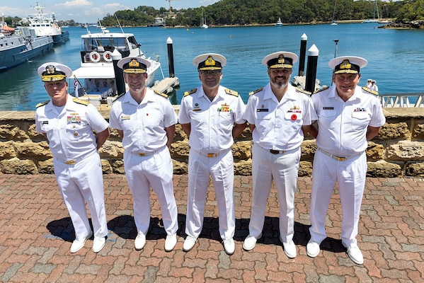 Leaders from the navies of Australia, Canada, New Zealand, the United Kingdom, and the United States pose for a photograph in Sydney.