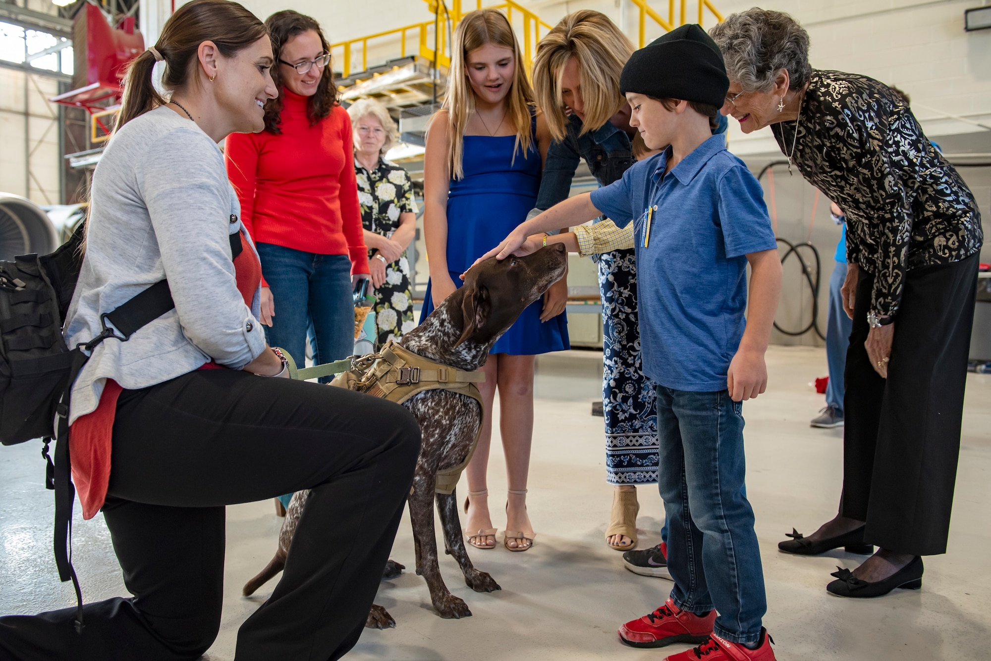 Murphy, a therapy dog with 121st Air Refueling Wing Director of Psychological Health office, greets Airmen and their families after a Change of Command ceremony at Rickenbacker Air National Guard Base, Ohio, Nov. 5, 2023. Murphy’s role with the DPH is to bring joy to Airmen and their families and to help encourage conversations with the resiliency team.