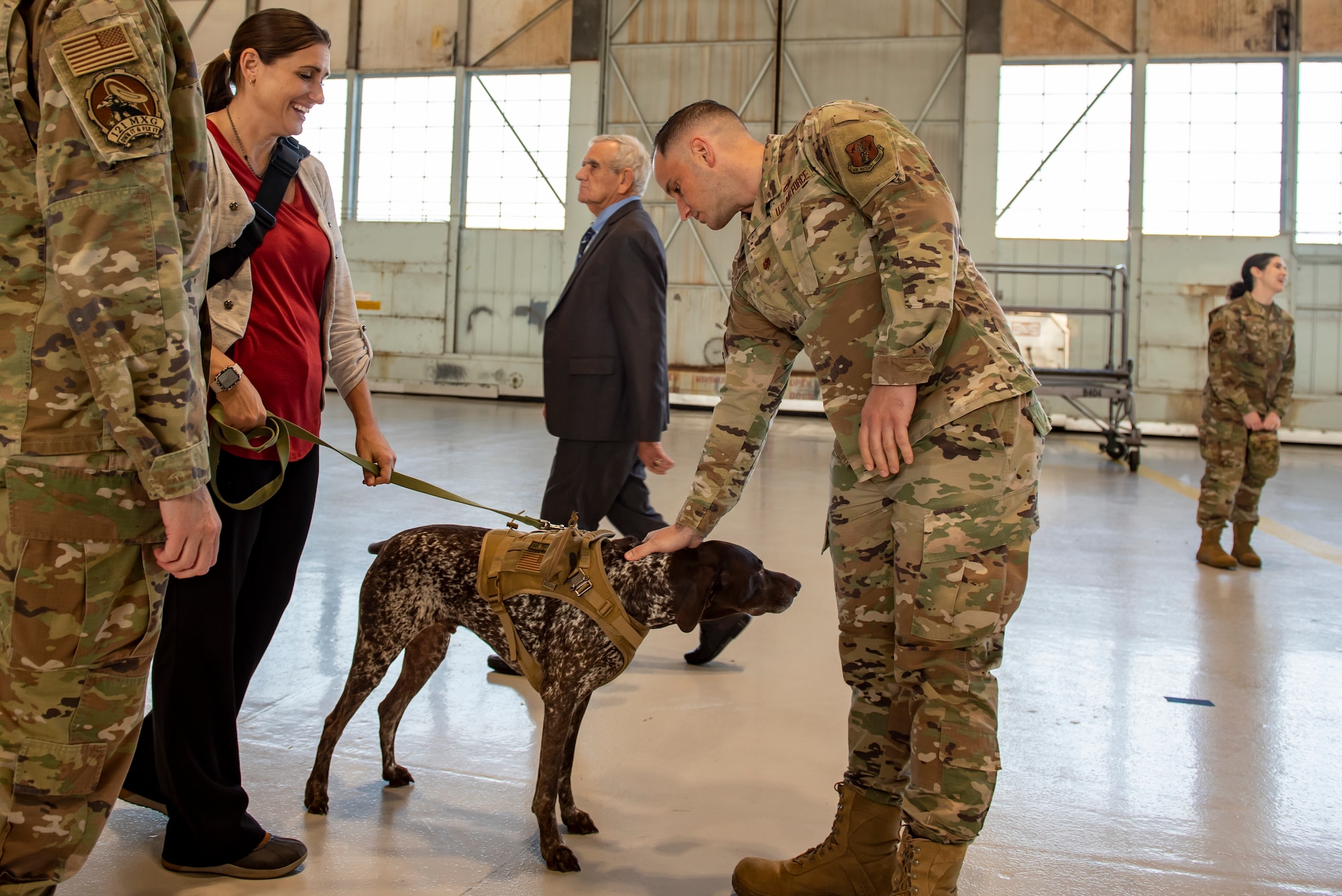 Murphy, a therapy dog with 121st Air Refueling Wing Director of Psychological Health office, greets Airmen and their families after a Change of Command ceremony at Rickenbacker Air National Guard Base, Ohio, Nov. 5, 2023. Murphy’s role with the DPH is to bring joy to Airmen and their families and to help encourage conversations with the resiliency team.