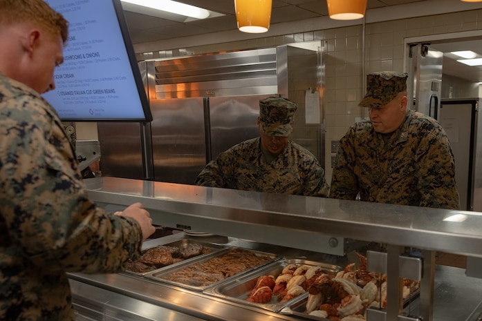 U.S. Marine Corps Col. Jason Freeby (Right), commanding officer, headquarters and service battalion, and Sgt. Maj. Carlos Aguilera, sergeant major headquarters and service battalion, serve lunch to Marines at the mess hall in honor of the 248th Marine Corps Birthday at Marine Corps Recruit Depot, San Diego, Nov. 9, 2023. The Marine Corps birthday, on Nov. 10, 1775, is celebrated every year to commemorate the birth of the Corps and honor the service and sacrifices of all Marines, past and present. (U.S. Marine Corps photo by Lance Cpl. Jacob B. Hutchinson)