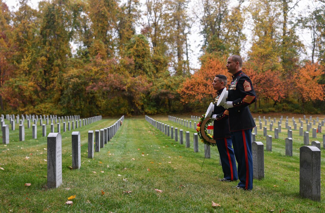 U.S. Marine Corps Master Sgt. Rolando J. De Hoyos, operations chief, security battalion, Marine Corps Base Quantico, left, and Sgt. Maj. Collin D. Barry, Marine Corps Base Quantico sergeant major, a native of Tucumcari, New Mexico, right, take a moment of silence in remembrance of Sgt. Maj. Henry H. Black, 7th Sergeant Major of the Marine Corps, during a wreath laying ceremony at the Quantico National Cemetery, Triangle, Virginia, Nov. 10, 2023. The ceremony is held annually on the Marine Corps birthday to honor the memory and military service of Sgt. Maj. Black. (U.S. Marine Corps photo by Lance Cpl. David Brandes)