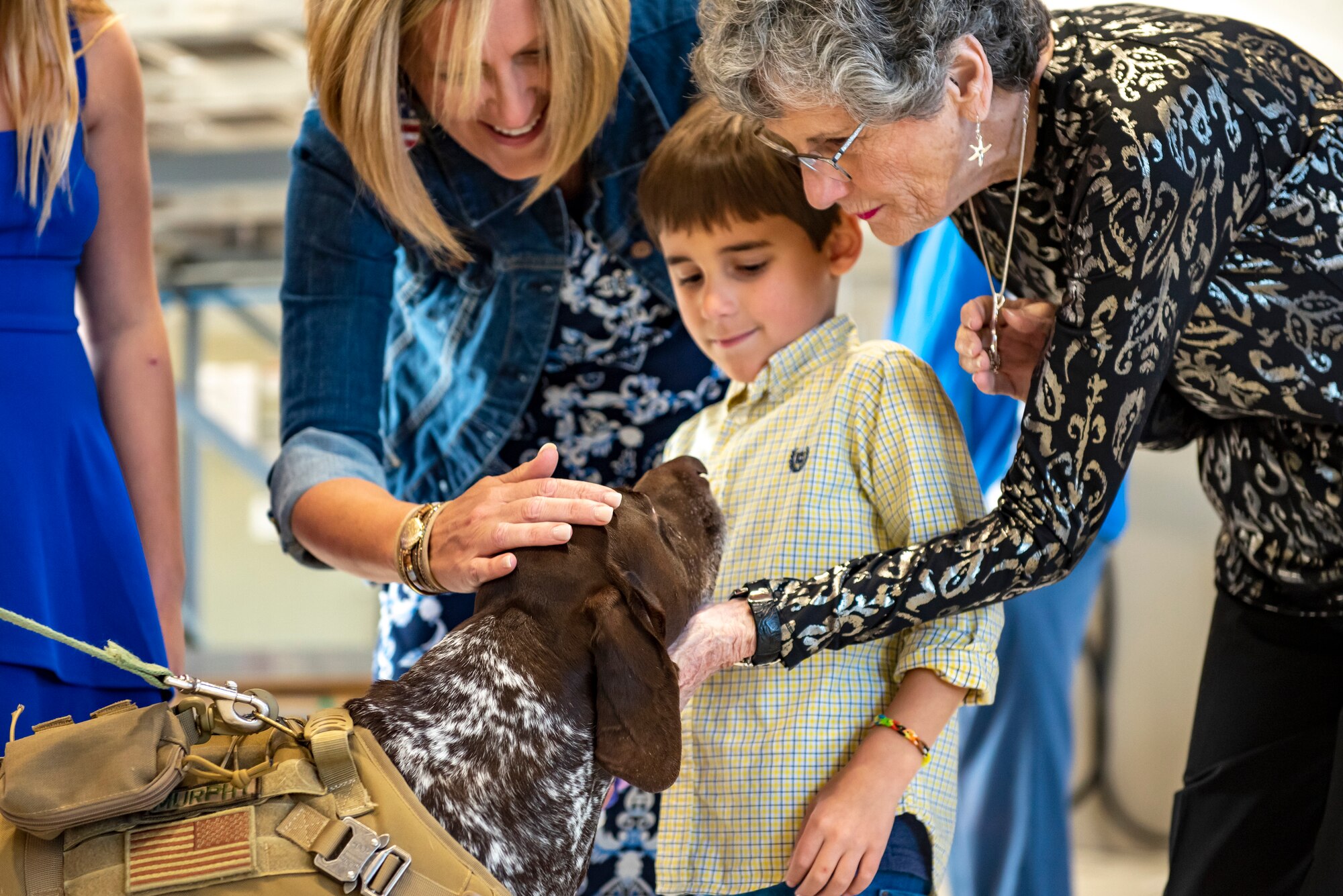 Murphy, a therapy dog with 121st Air Refueling Wing Director of Psychological Health office, greets Airmen and their families after a Change of Command ceremony at Rickenbacker Air National Guard Base, Ohio, Nov. 5, 2023. Murphy’s role with the DPH is to bring joy to Airmen and their families and to help encourage conversations with the resiliency team.