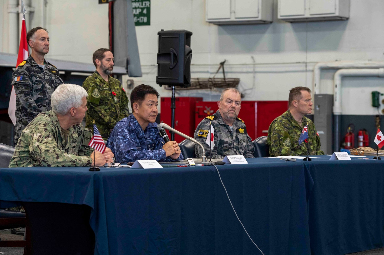 231111-N-TL932-1227 PHILIPPINE SEA (Nov. 11, 2023) Senior leaders from Canada, Australia, Japan and U.S. navies conduct a multilateral press conference aboard Nimitz-class aircraft carrier USS Carl Vinson (CVN 70) during Annual Exercise (ANNUALEX) 2023. ANNUALEX is a multilateral exercise conducted by naval elements of the Royal Australian, Royal Canadian, Japan Maritime Self-Defense Force, and U.S. navies to demonstrate naval interoperability and a joint commitment to a free and open Indo-Pacific. Vinson, flagship of Carrier Strike Group ONE, is deployed to the U.S. 7th Fleet area of operations in support of a free and open Indo-Pacific. (U.S. Navy photo by Mass Communication Specialist 3rd Class Joshua Sapien)