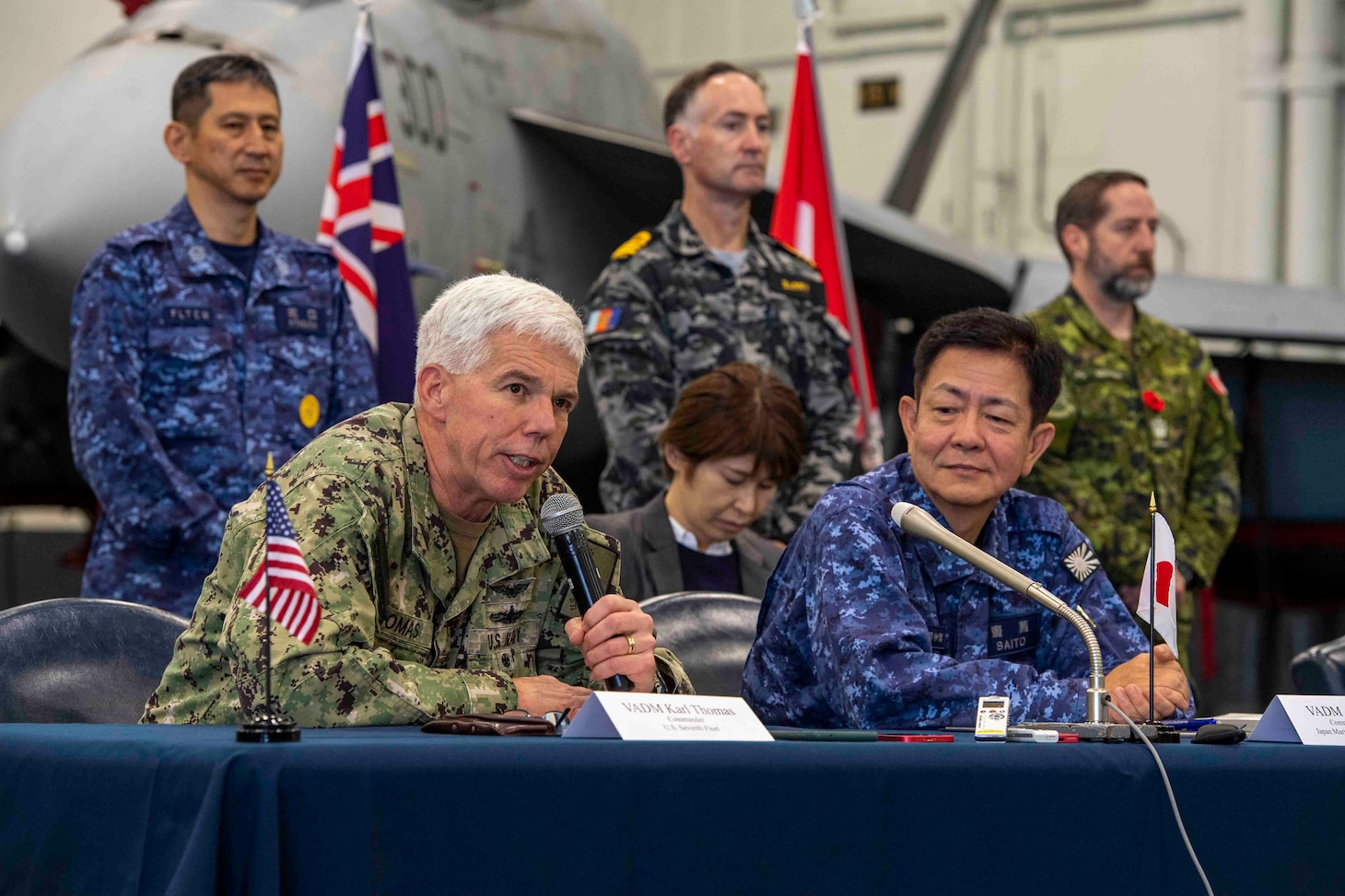 231111-N-TL932-1247 PHILIPPINE SEA (Nov. 11, 2023) Vice Adm. Karl Thomas, left, Commander, 7th Fleet and Vice Adm. Akira Saito, Commander in Chief, Self-Defense Fleet, Japan Maritime Self-Defense Force, conduct a multilateral press conference aboard Nimitz-class aircraft carrier USS Carl Vinson (CVN 70) as part of Annual Exercise (ANNUALEX) 2023. ANNUALEX is a multilateral exercise conducted by naval elements of the Royal Australian, Royal Canadian, Japan Maritime Self-Defense Force, and U.S. navies to demonstrate naval interoperability and a joint commitment to a free and open Indo-Pacific. Vinson, flagship of Carrier Strike Group ONE, is deployed to the U.S. 7th Fleet area of operations in support of a free and open Indo-Pacific. (U.S. Navy photo by Mass Communication Specialist 3rd Class Joshua Sapien)