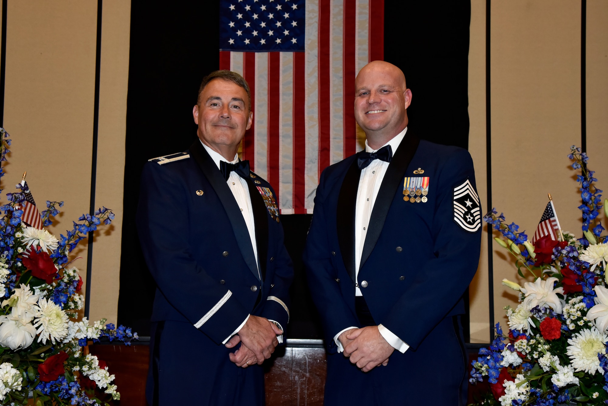 From left, U.S. Air Force Col. Michael Adams, commander of the 117th Air Refueling Wing based out of Sumpter Smith Joint National Guard Base, Alabama, and Chief Master Sgt. Nathan Fallin, 117 ARW command chief, pose for a photo at the 76th National Veterans Day awards dinner hosted by the National Veterans Day Foundation on Nov. 10, 2023, in Birmingham, Alabama. A perpetual National Veterans Award was created in Birmingham for America’s first official National Veterans Day observance on November 11, 1954 as authorized by Congress. Its purpose is to honor an outstanding veteran in the United States each year who has made the greatest contribution to further the patriotic interests of veterans and veteran organizations throughout the country; and the award is presented at the National Veterans Award Dinner in Birmingham.