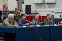 231111-N-TL932-1227 PHILIPPINE SEA (Nov. 11, 2023) Senior leaders from Canada, Australia, Japan and U.S. navies conduct a multilateral press conference aboard Nimitz-class aircraft carrier USS Carl Vinson (CVN 70) during Annual Exercise (ANNUALEX) 2023. ANNUALEX is a multilateral exercise conducted by naval elements of the Royal Australian, Royal Canadian, Japan Maritime Self-Defense Force, and U.S. navies to demonstrate naval interoperability and a joint commitment to a free and open Indo-Pacific. Vinson, flagship of Carrier Strike Group ONE, is deployed to the U.S. 7th Fleet area of operations in support of a free and open Indo-Pacific. (U.S. Navy photo by Mass Communication Specialist 3rd Class Joshua Sapien)