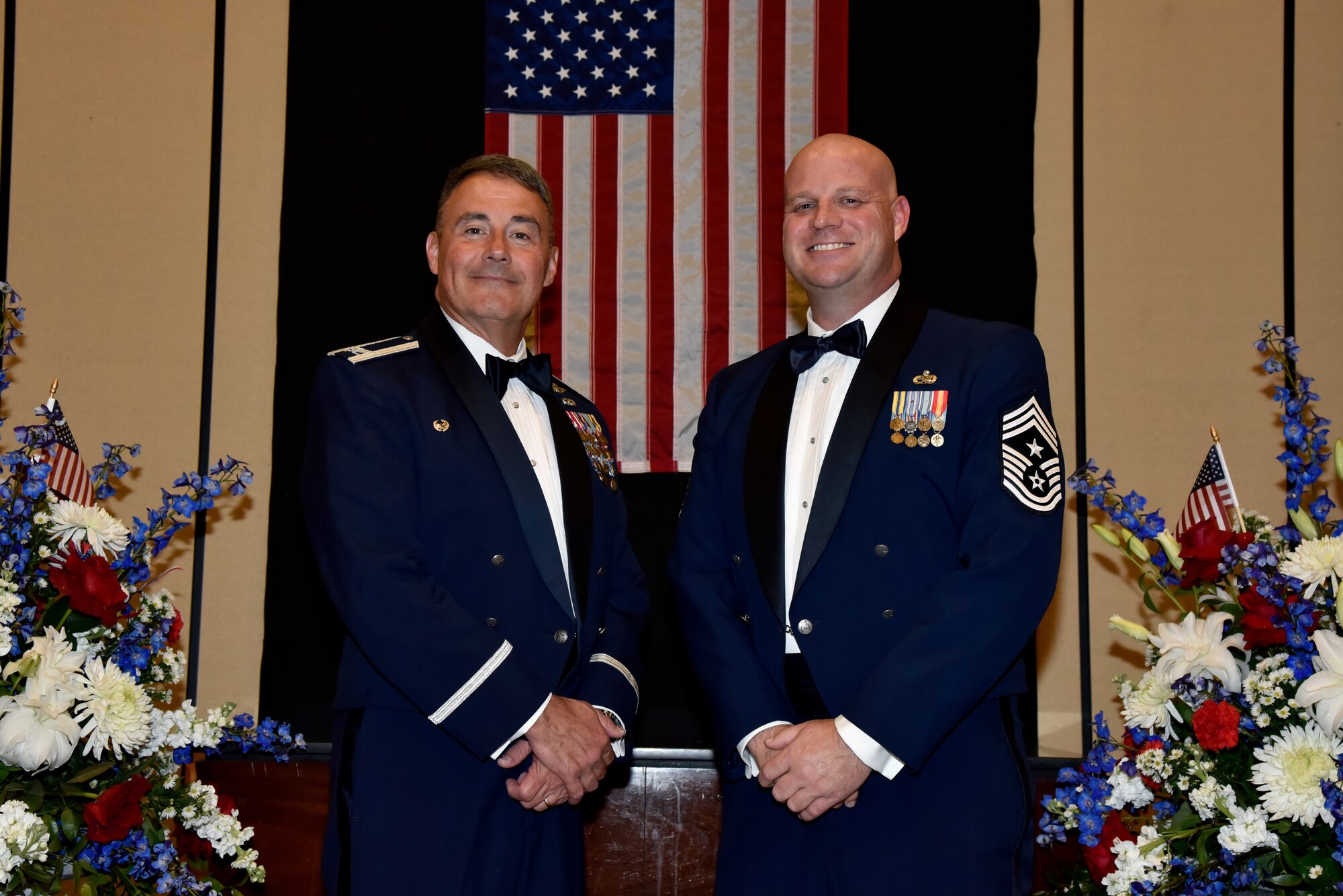 From left, U.S. Air Force Col. Michael Adams, commander of the 117th Air Refueling Wing based out of Sumpter Smith Joint National Guard Base, Alabama, and Chief Master Sgt. Nathan Fallin, 117 ARW command chief, pose for a photo at the 76th National Veterans Day awards dinner hosted by the National Veterans Day Foundation on Nov. 10, 2023, in Birmingham, Alabama. A perpetual National Veterans Award was created in Birmingham for America’s first official National Veterans Day observance on November 11, 1954 as authorized by Congress. Its purpose is to honor an outstanding veteran in the United States each year who has made the greatest contribution to further the patriotic interests of veterans and veteran organizations throughout the country; and the award is presented at the National Veterans Award Dinner in Birmingham.